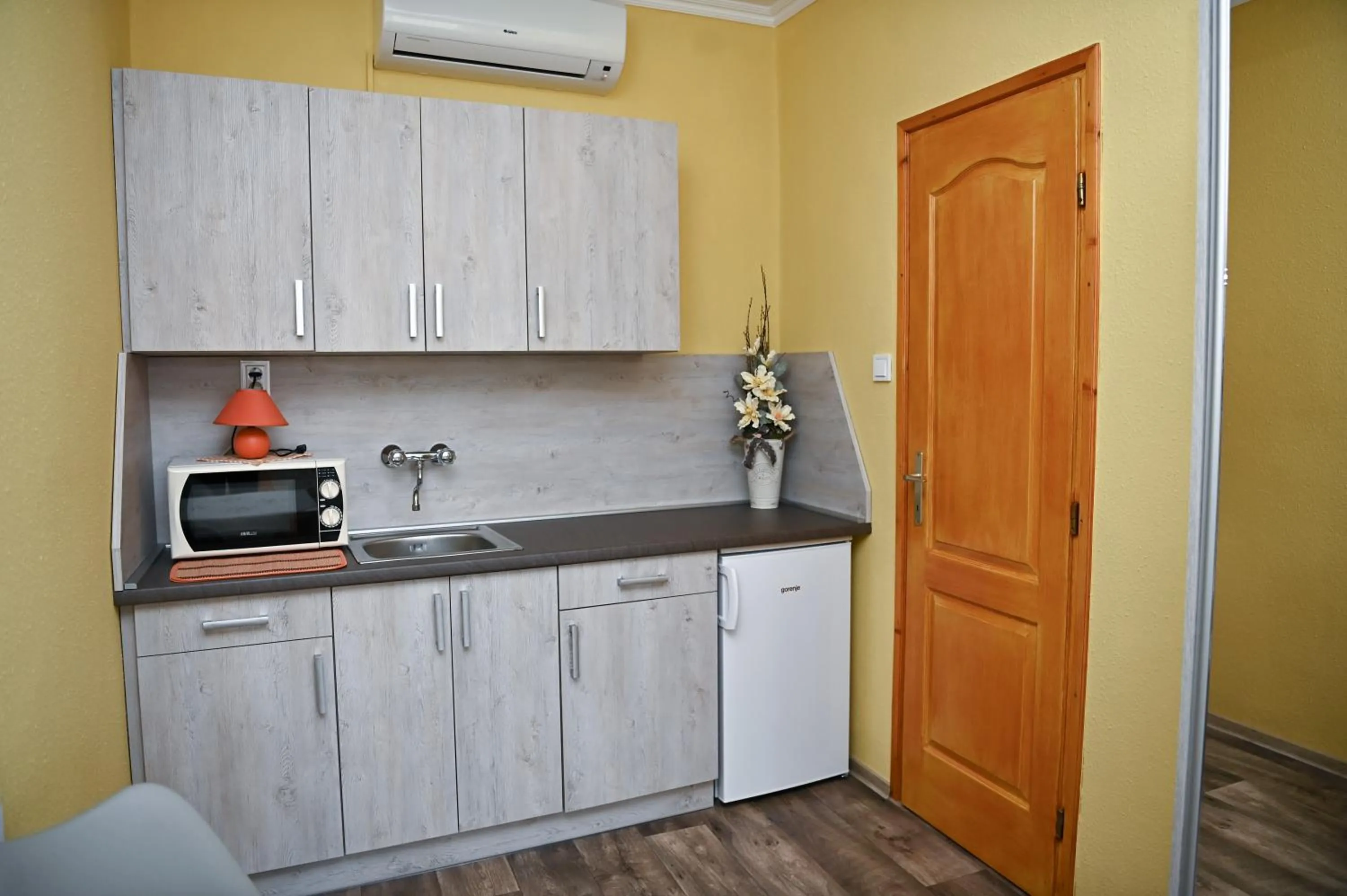 Kitchen or kitchenette in Angéla Vendegház