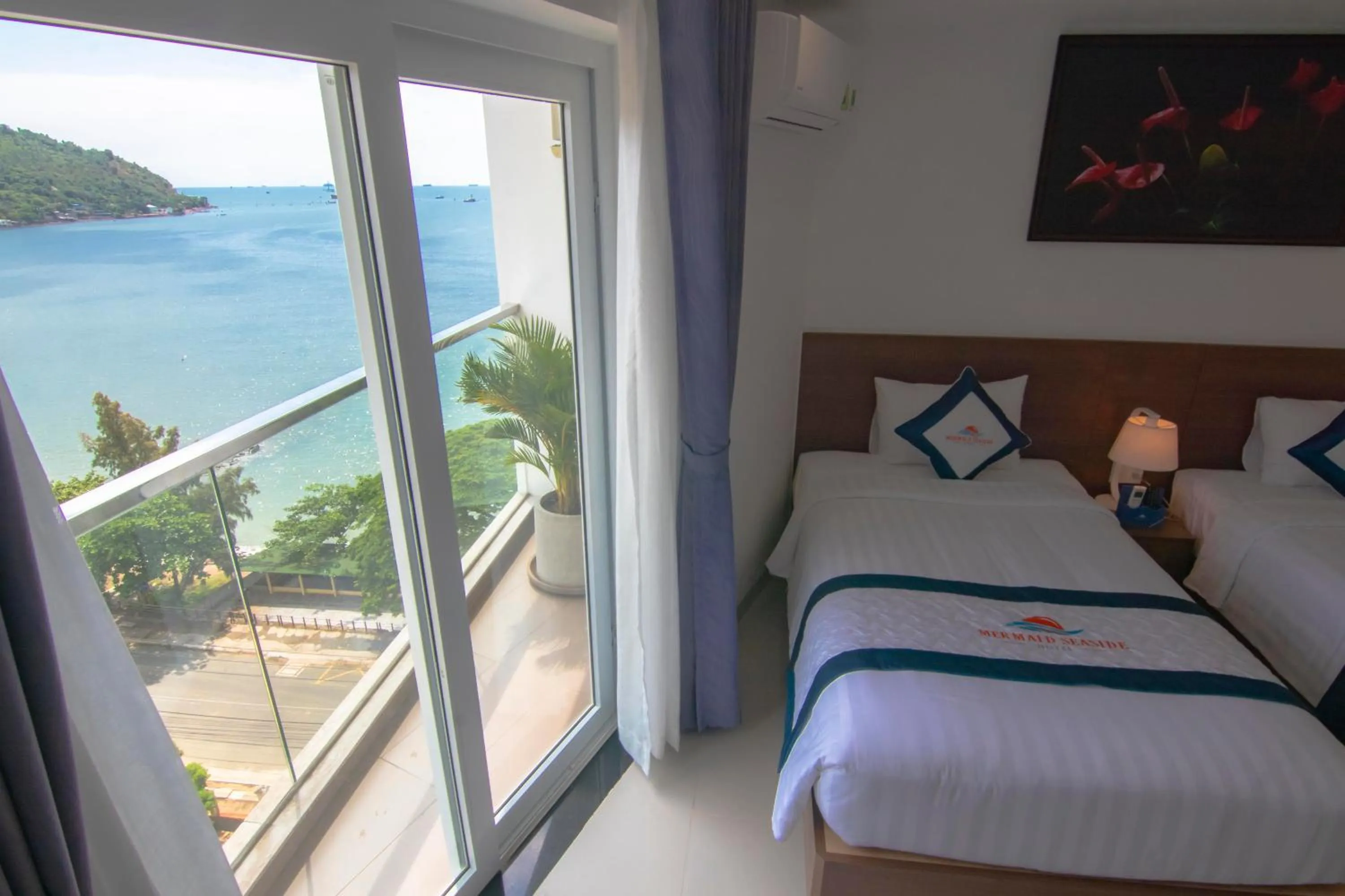 Balcony/Terrace, Bed in Mermaid Seaside Hotel