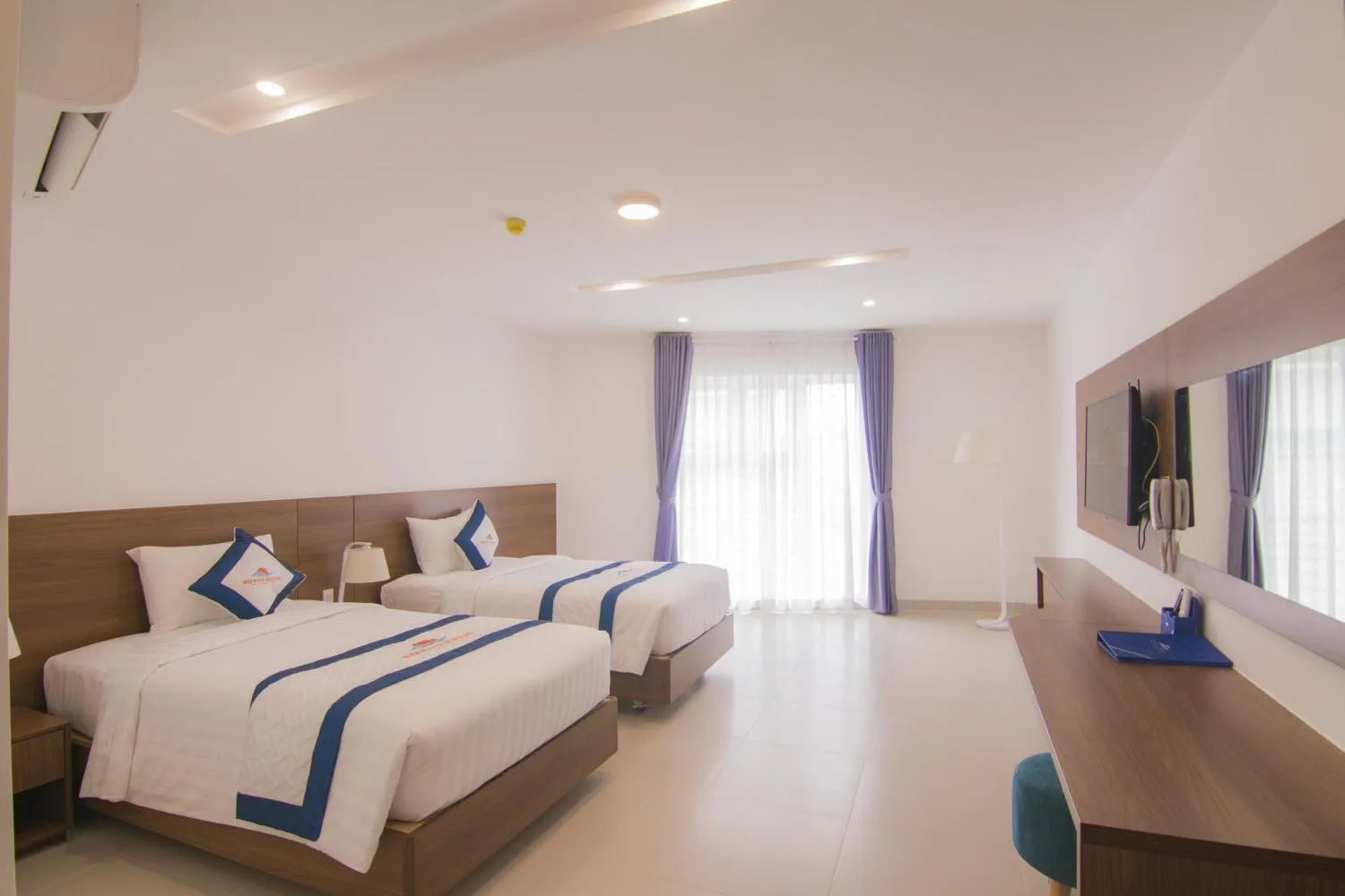 Bed in Mermaid Seaside Hotel