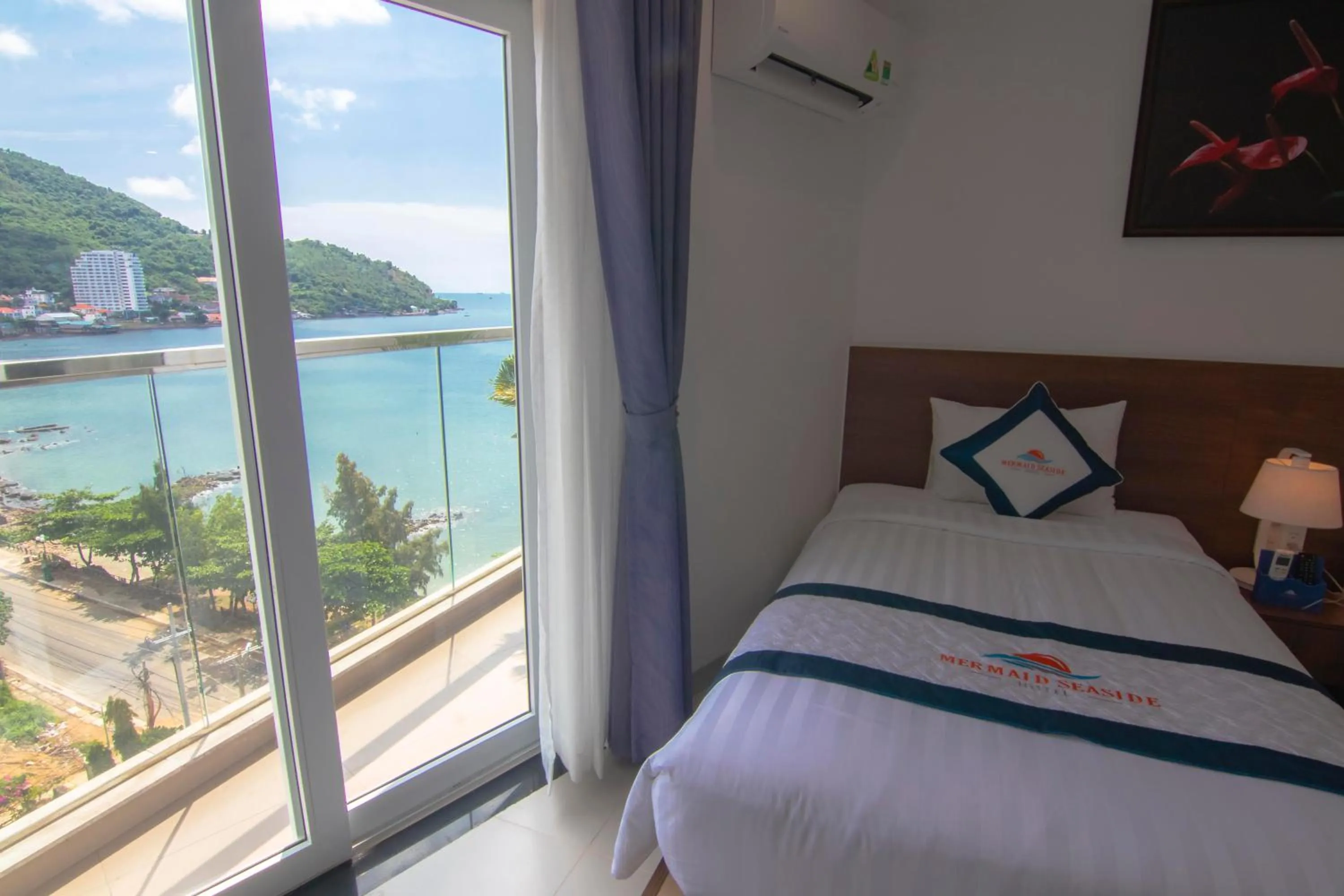 Balcony/Terrace, Bed in Mermaid Seaside Hotel