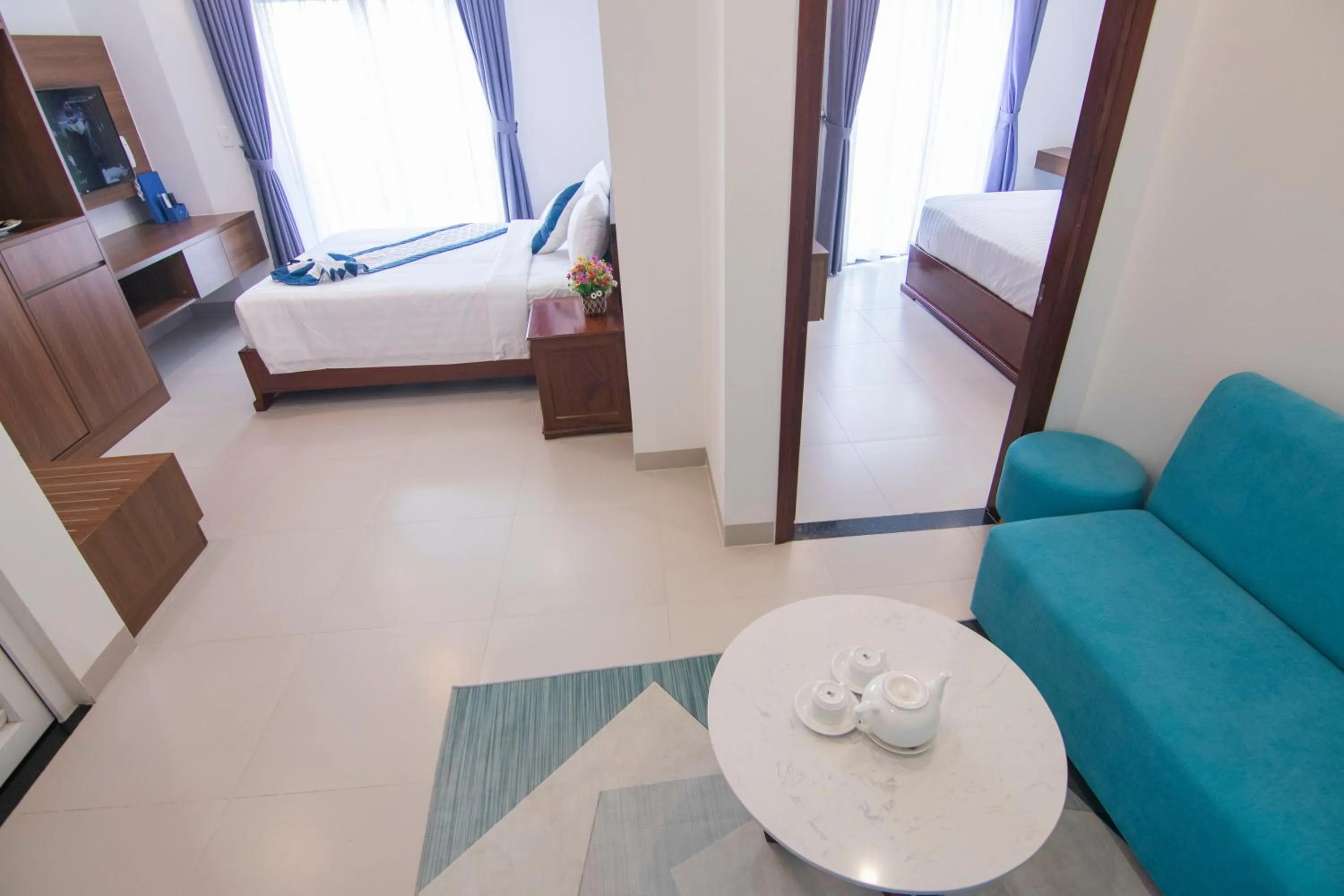 Living room, Bed in Mermaid Seaside Hotel