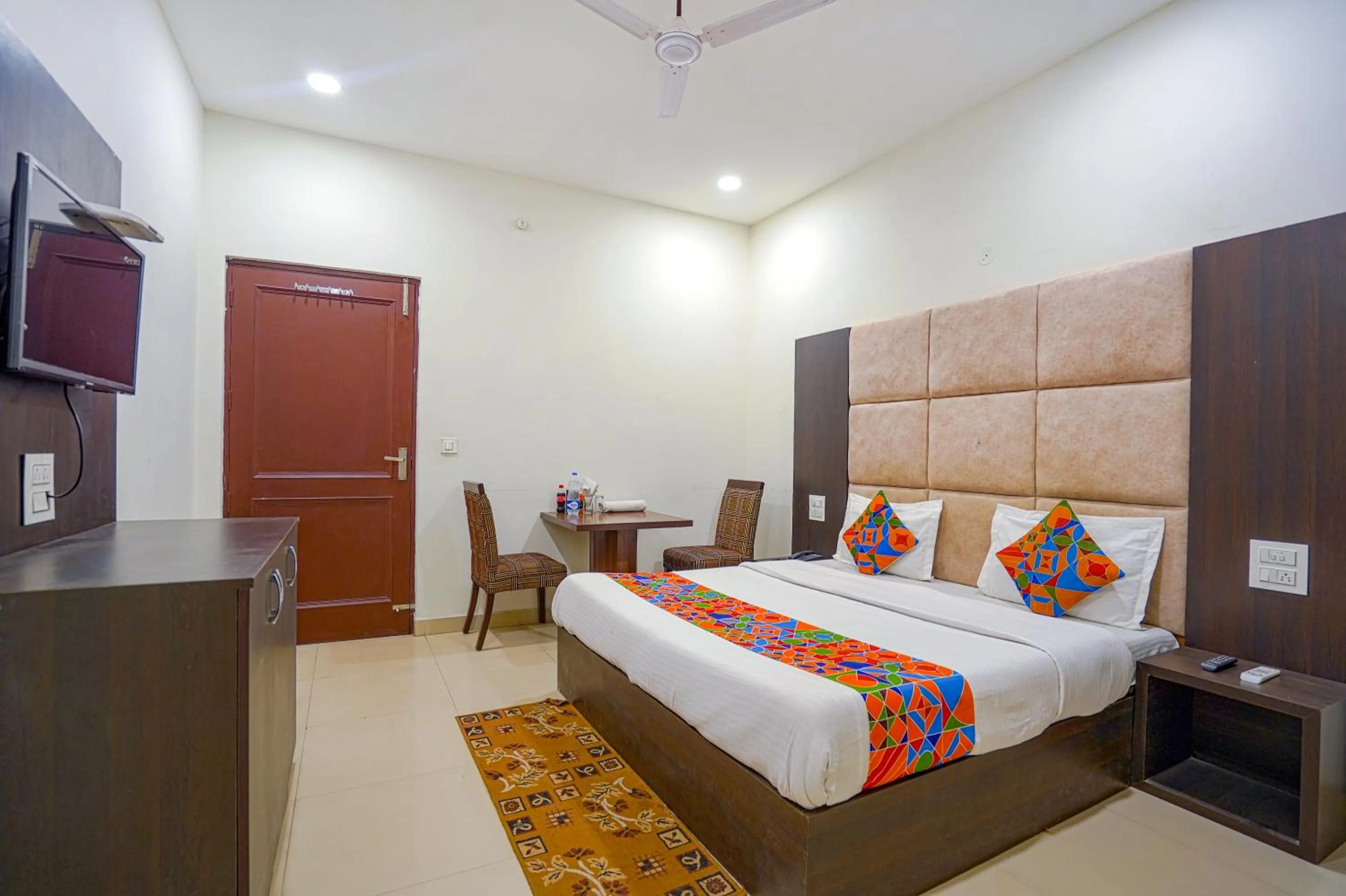 Bed in FabHotel Grand Inn