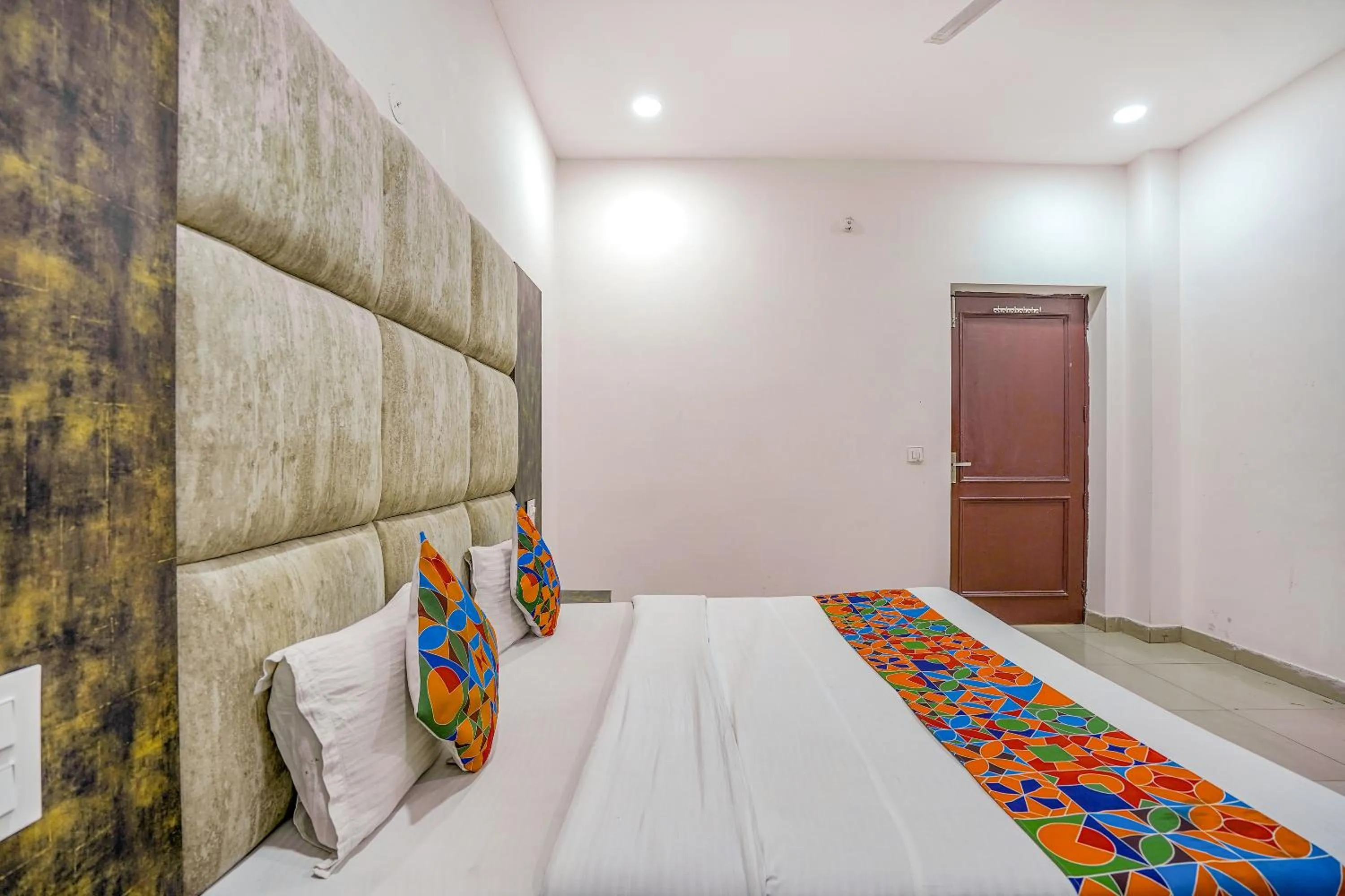 Bed in FabHotel Grand Inn