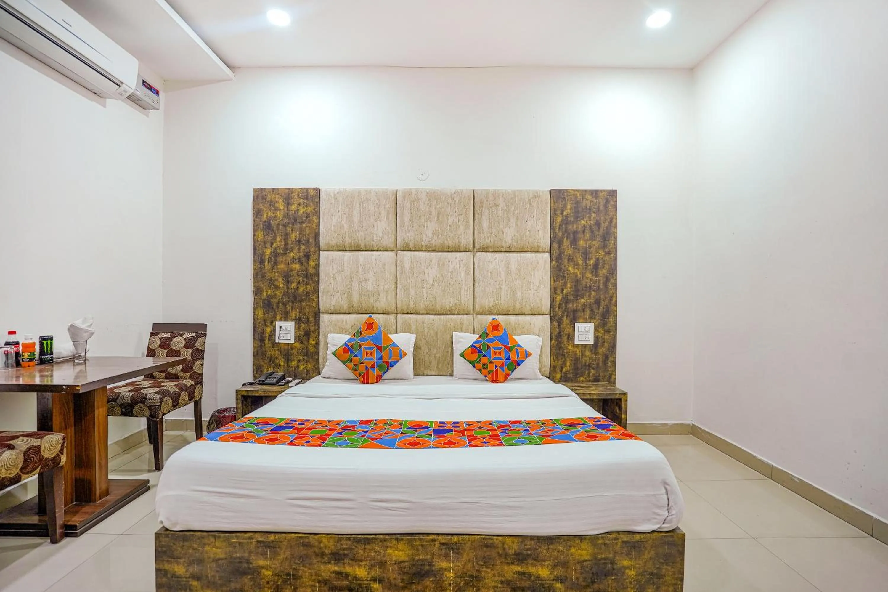 Bed in FabHotel Grand Inn