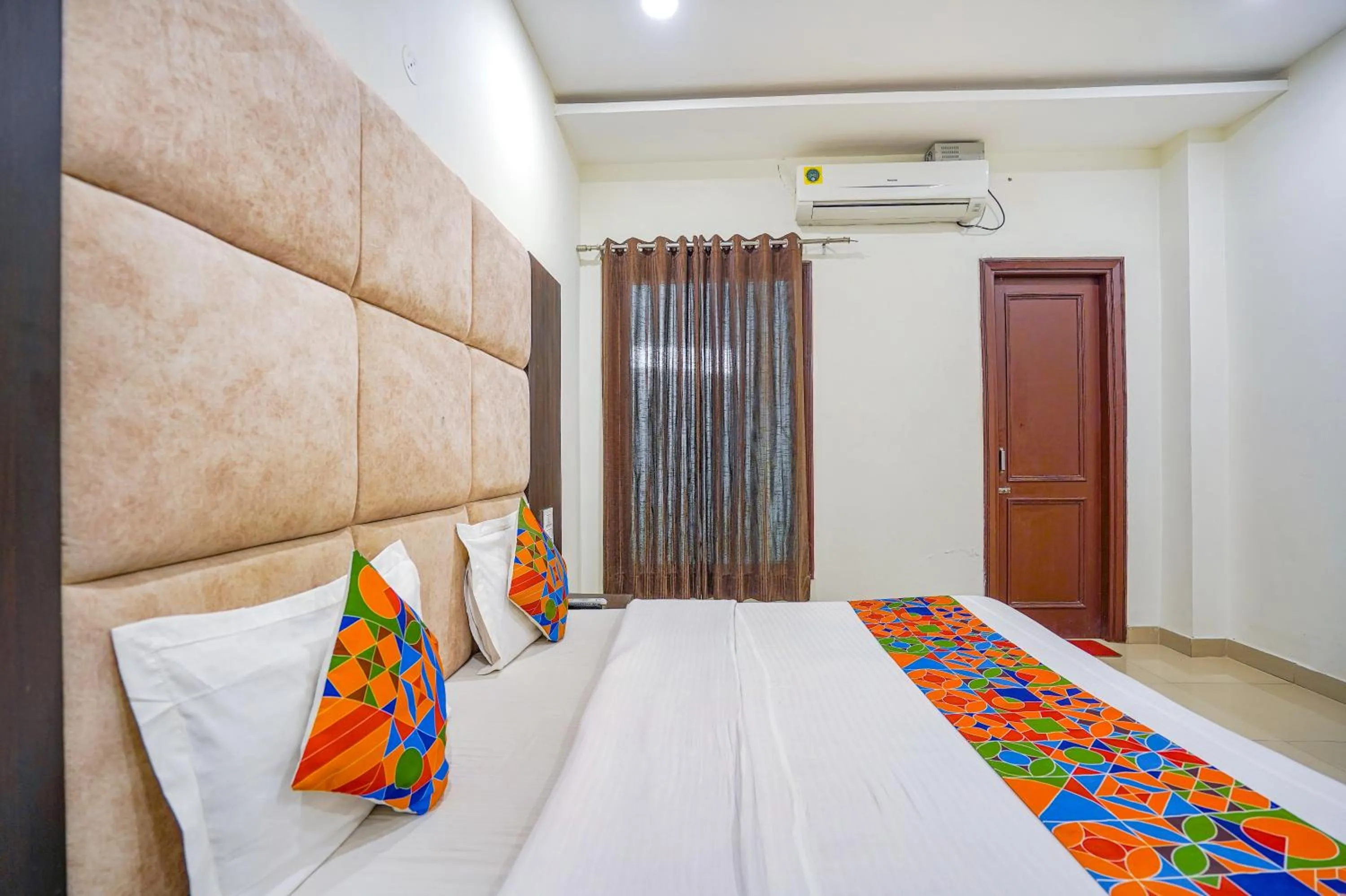 Bed in FabHotel Grand Inn