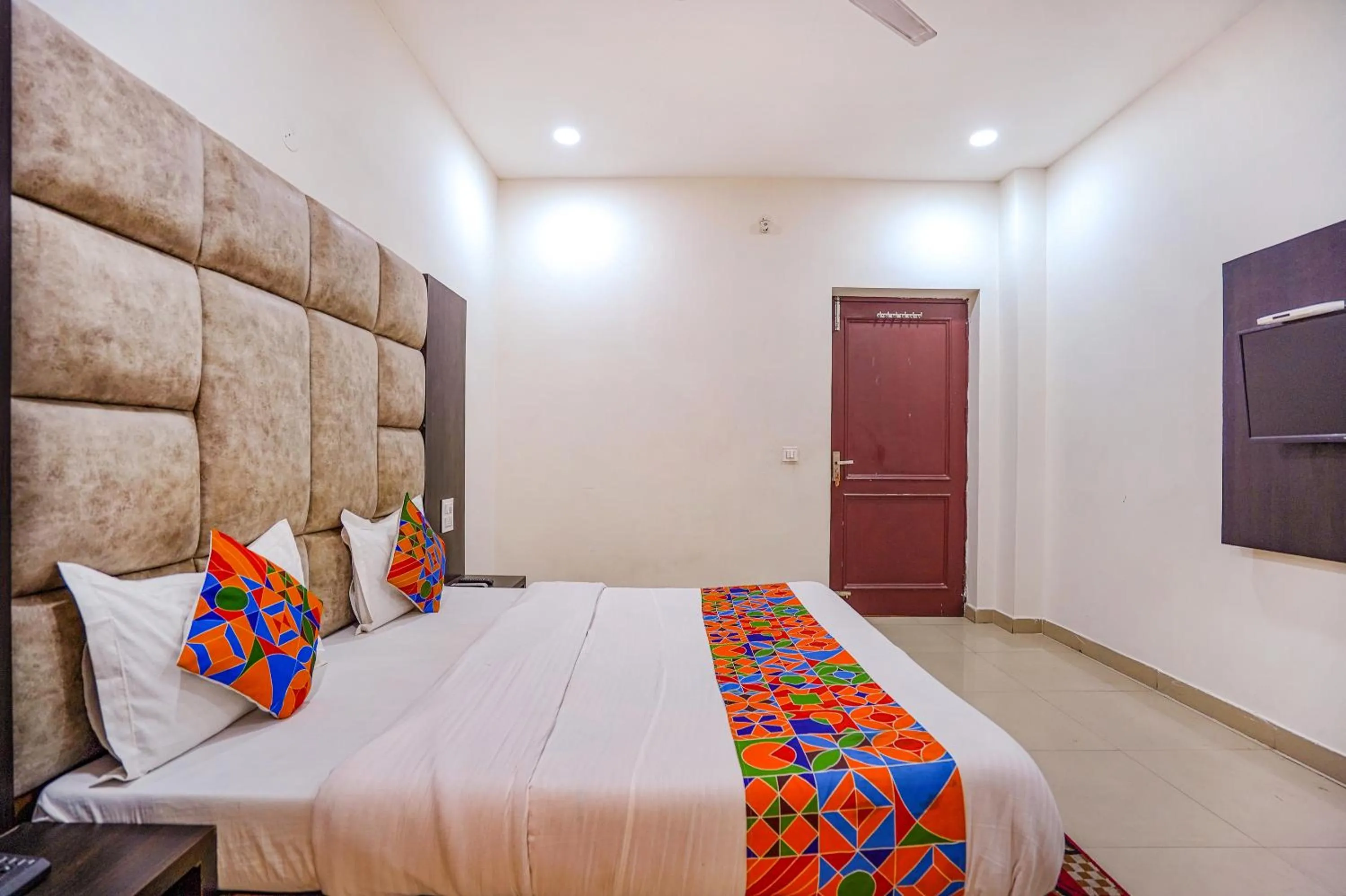 Bed in FabHotel Grand Inn