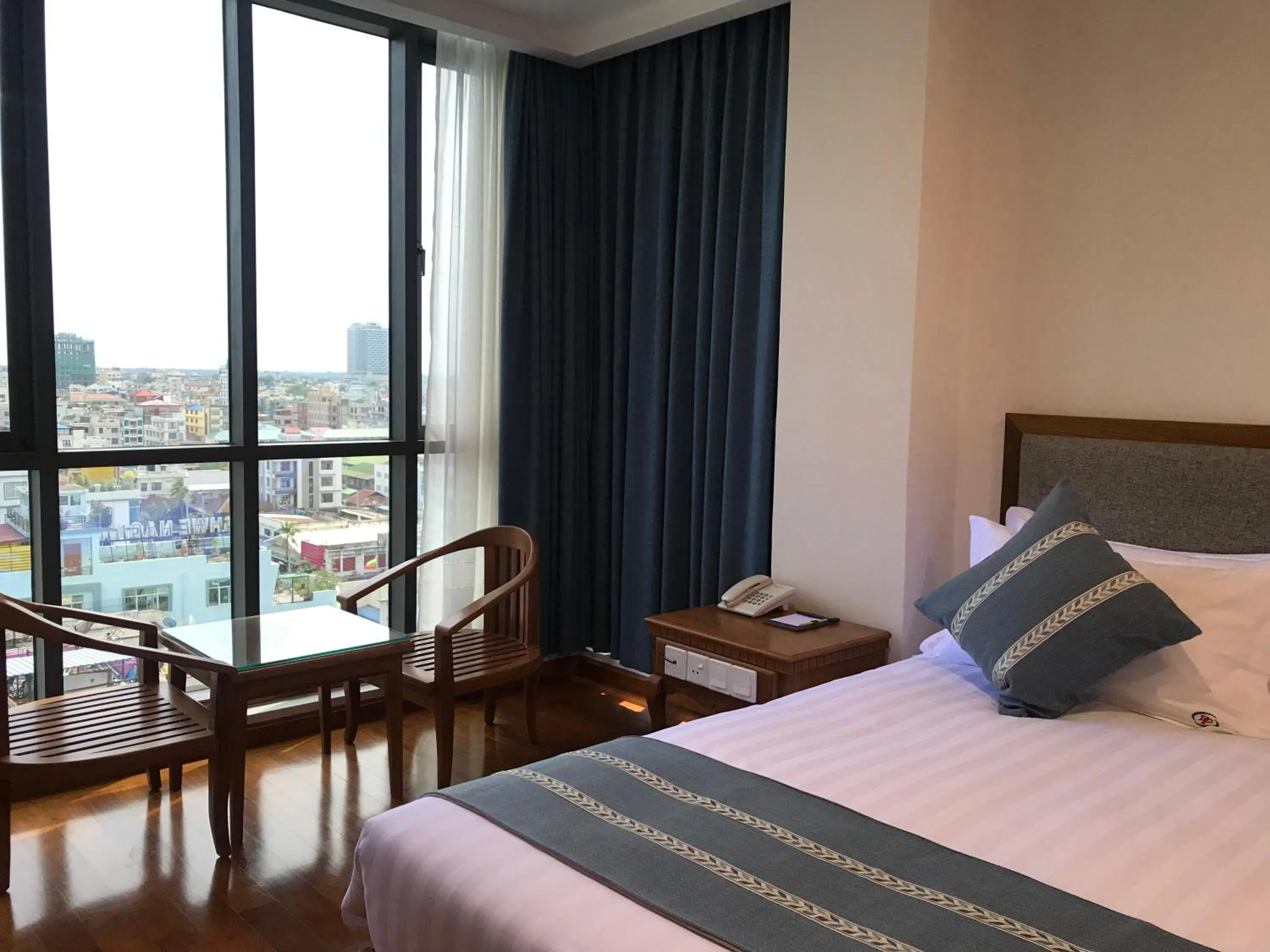 Bed in Dragon Phoenix Hotel