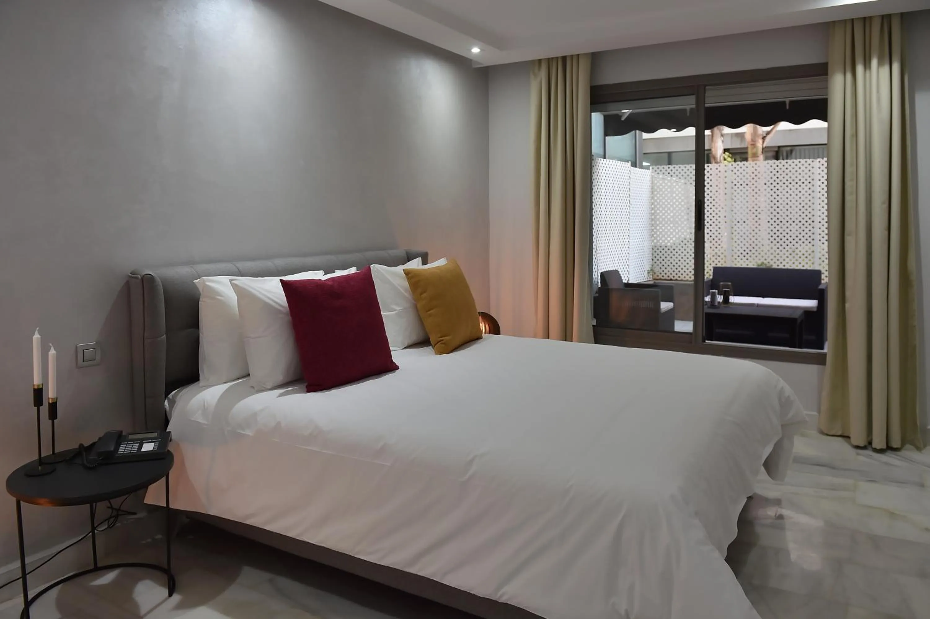 Bed in Le Yacht Suites Hotel