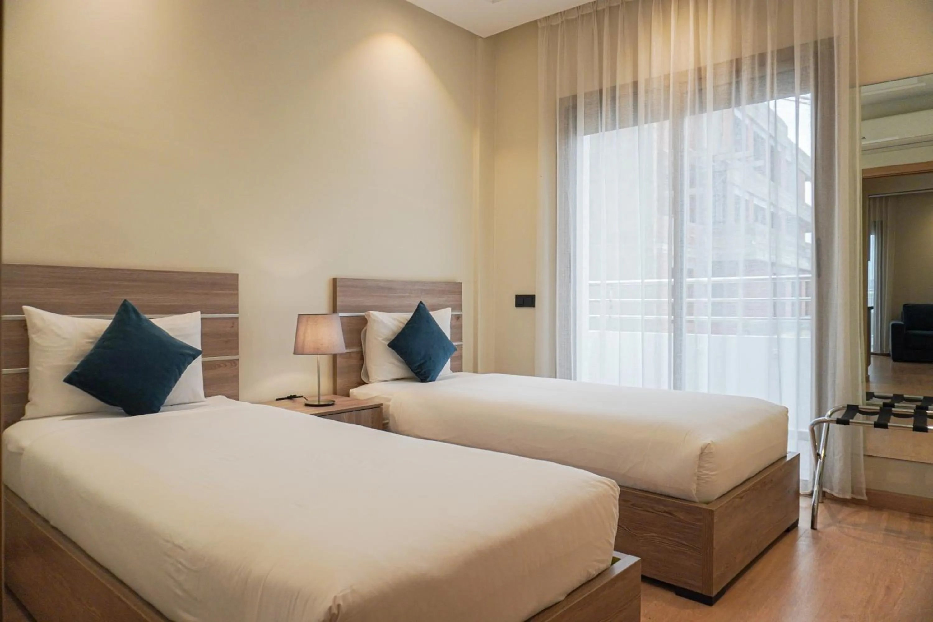 Bed in Flamant Rose Appart Hotel