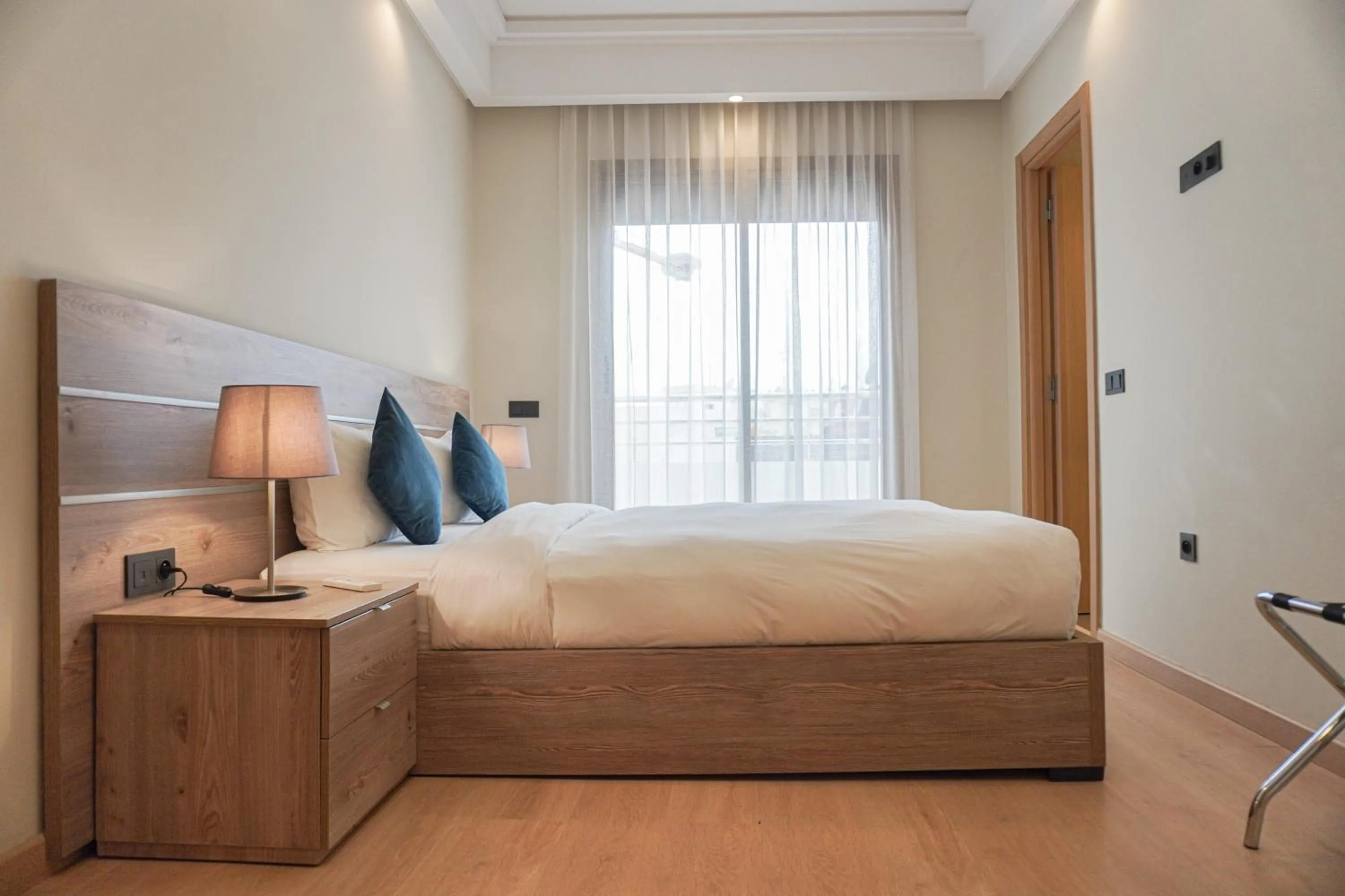 Property building, Bed in Flamant Rose Appart Hotel