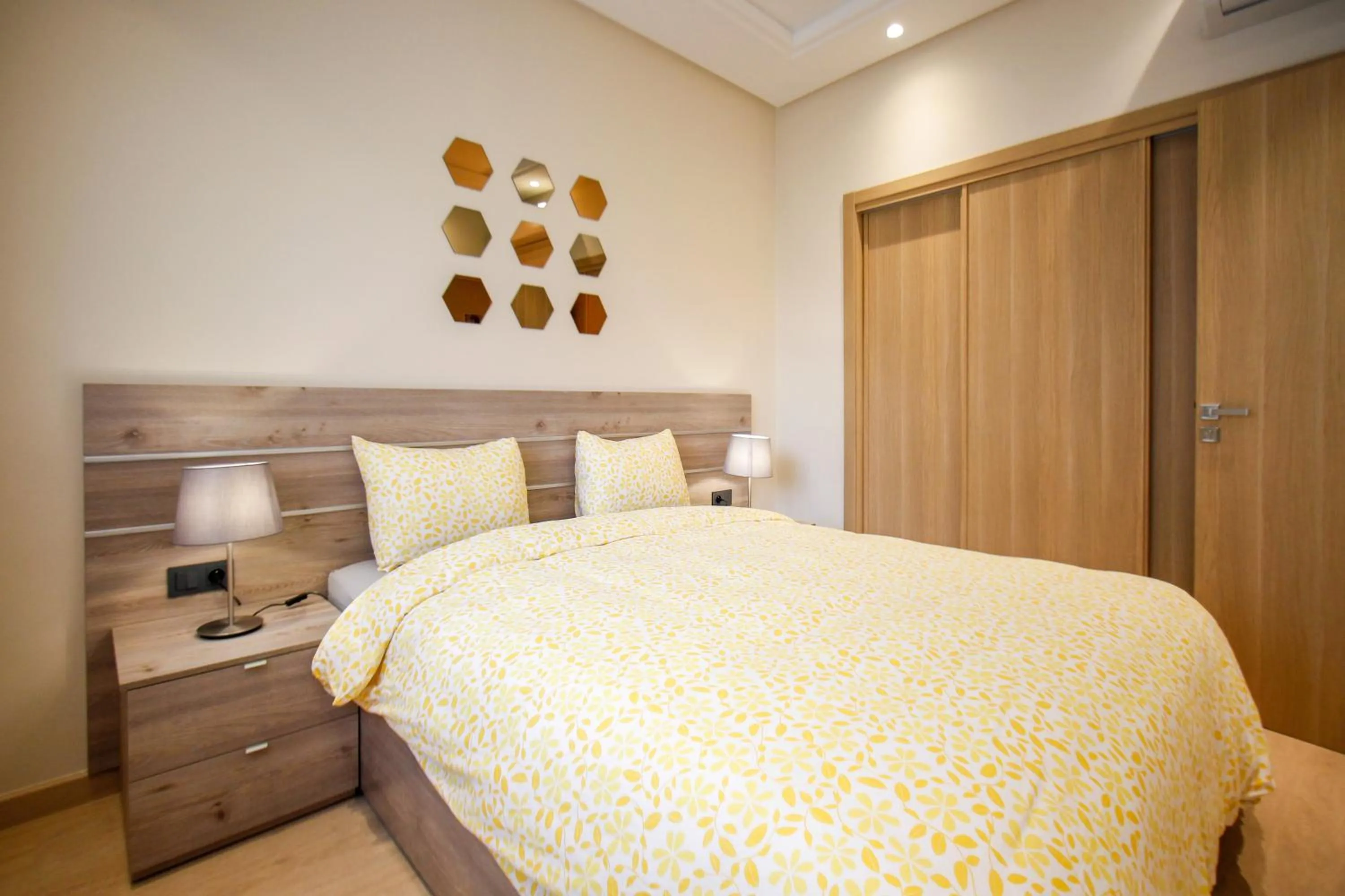 Bed in Flamant Rose Appart Hotel