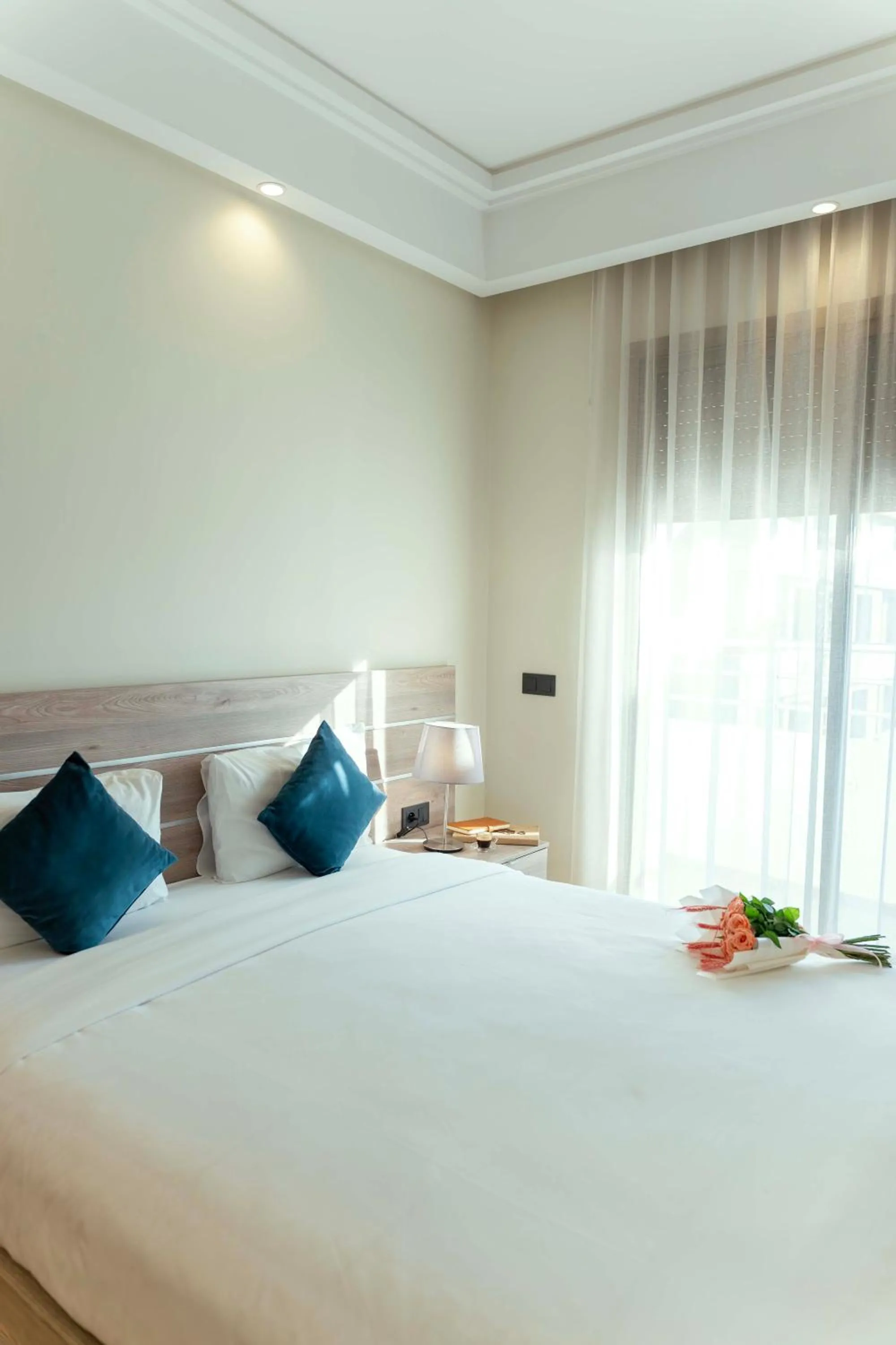 Bed in Flamant Rose Appart Hotel