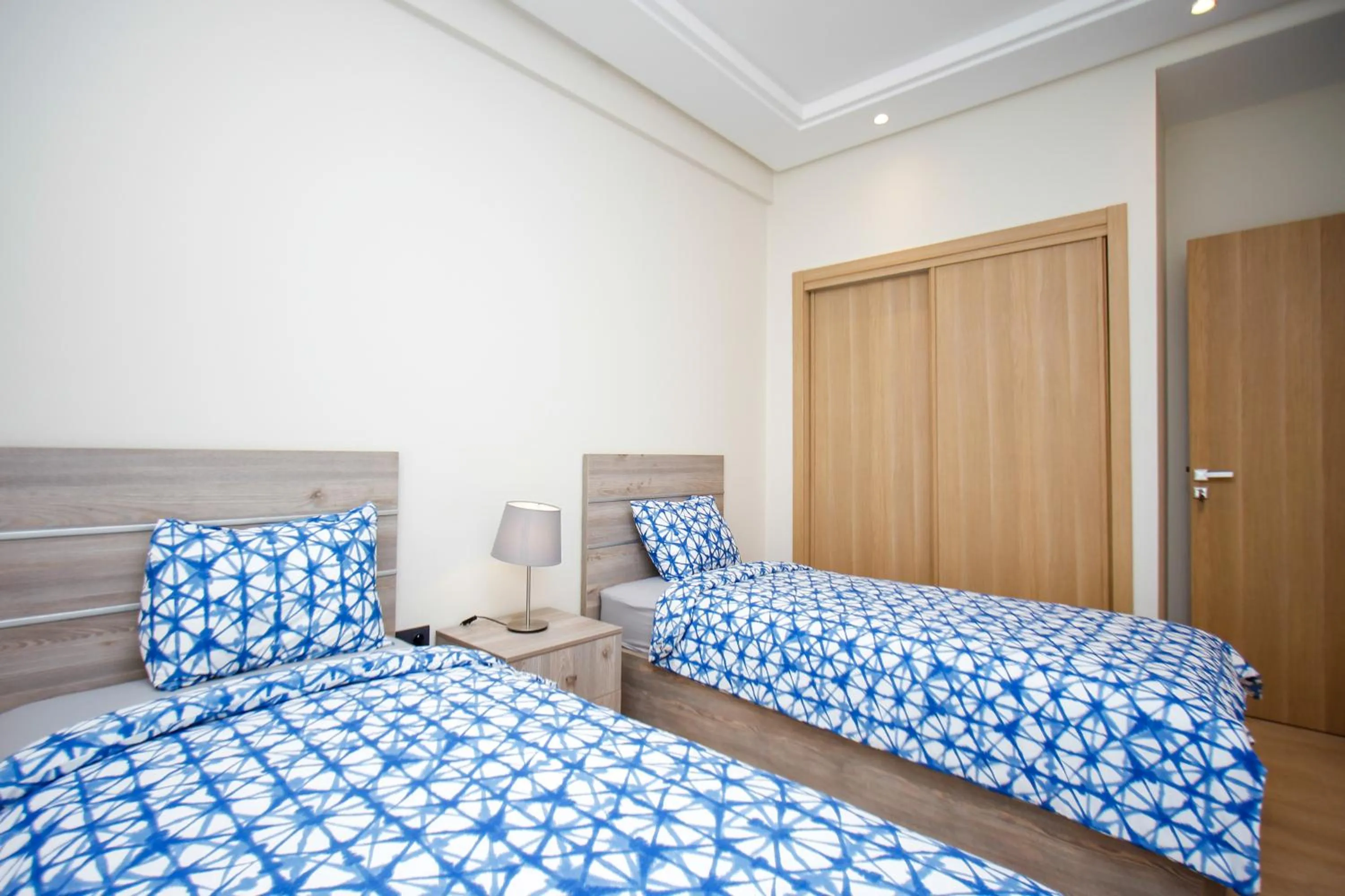 Bed in Flamant Rose Appart Hotel