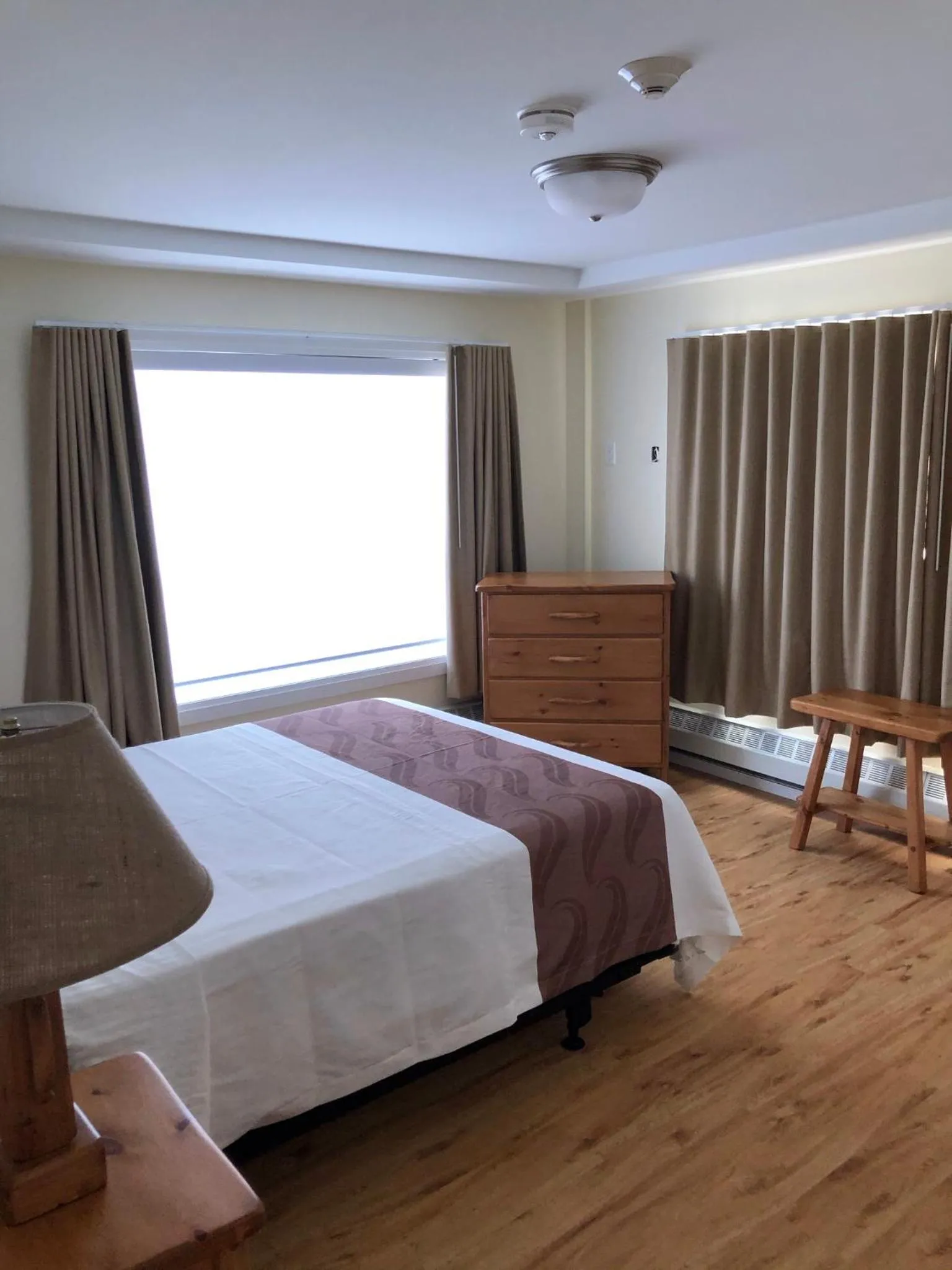 Bed in Muskoka Lakes Hotel and Resorts