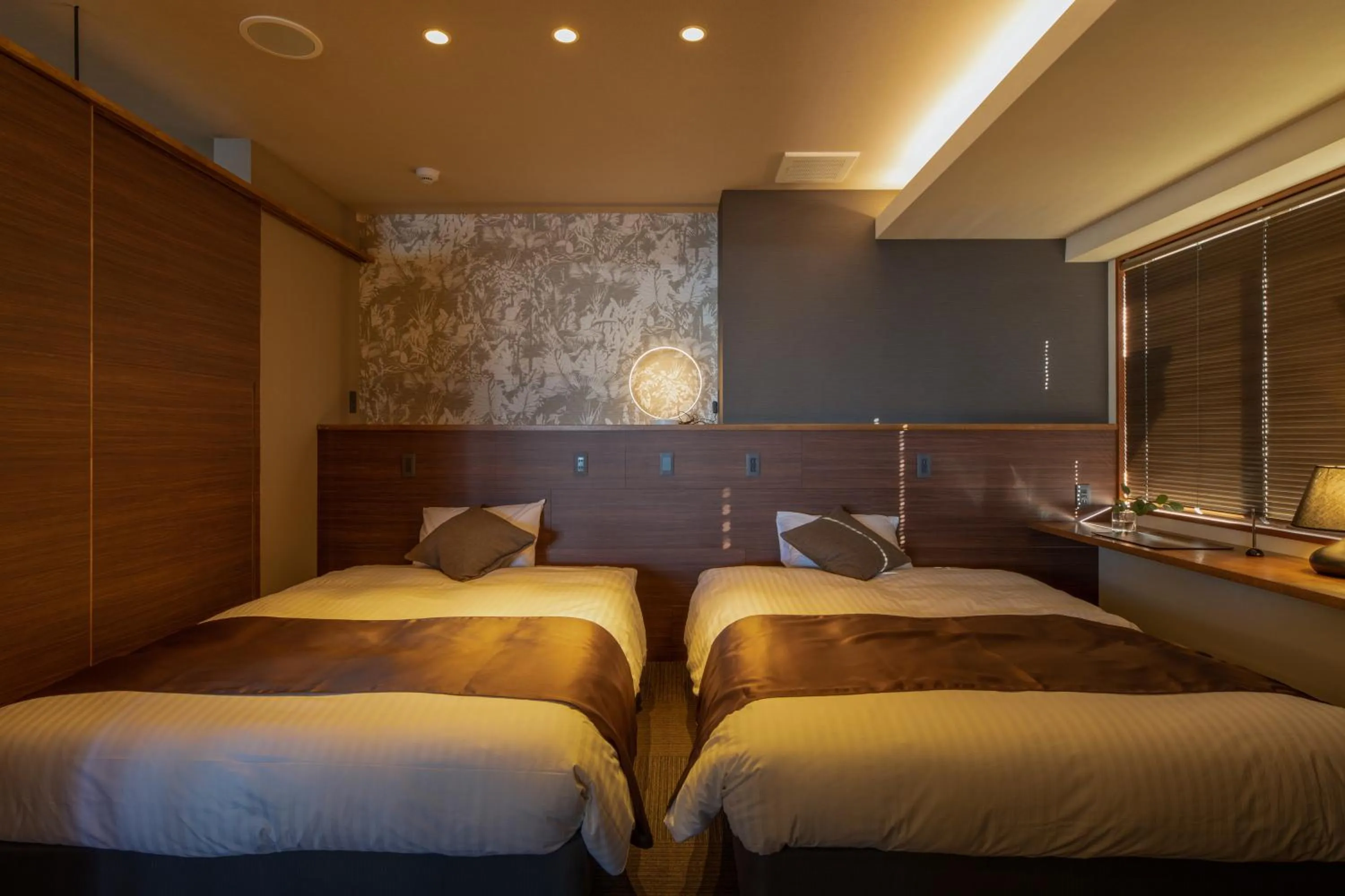 Bed in ITADAKI Daisen 大山参道ホテル頂