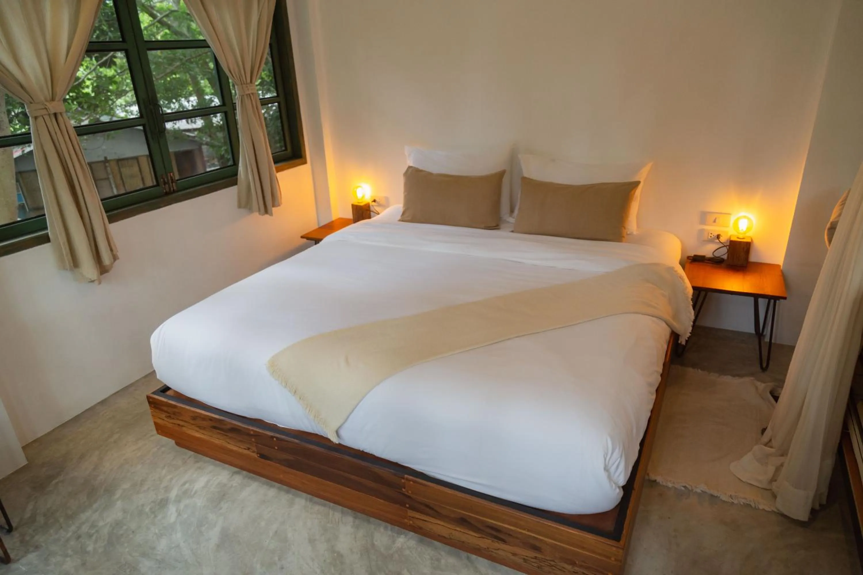 Bed in Big Tree Boutique Hotel