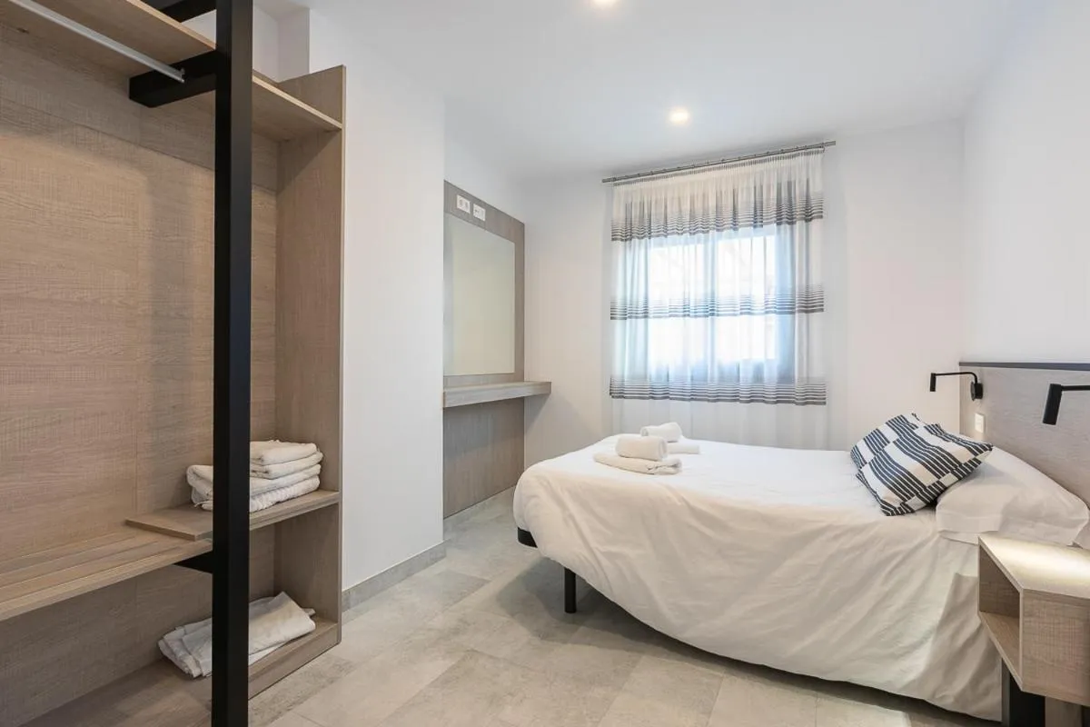 Bedroom, Bed in Apartamentos Guerrero 3