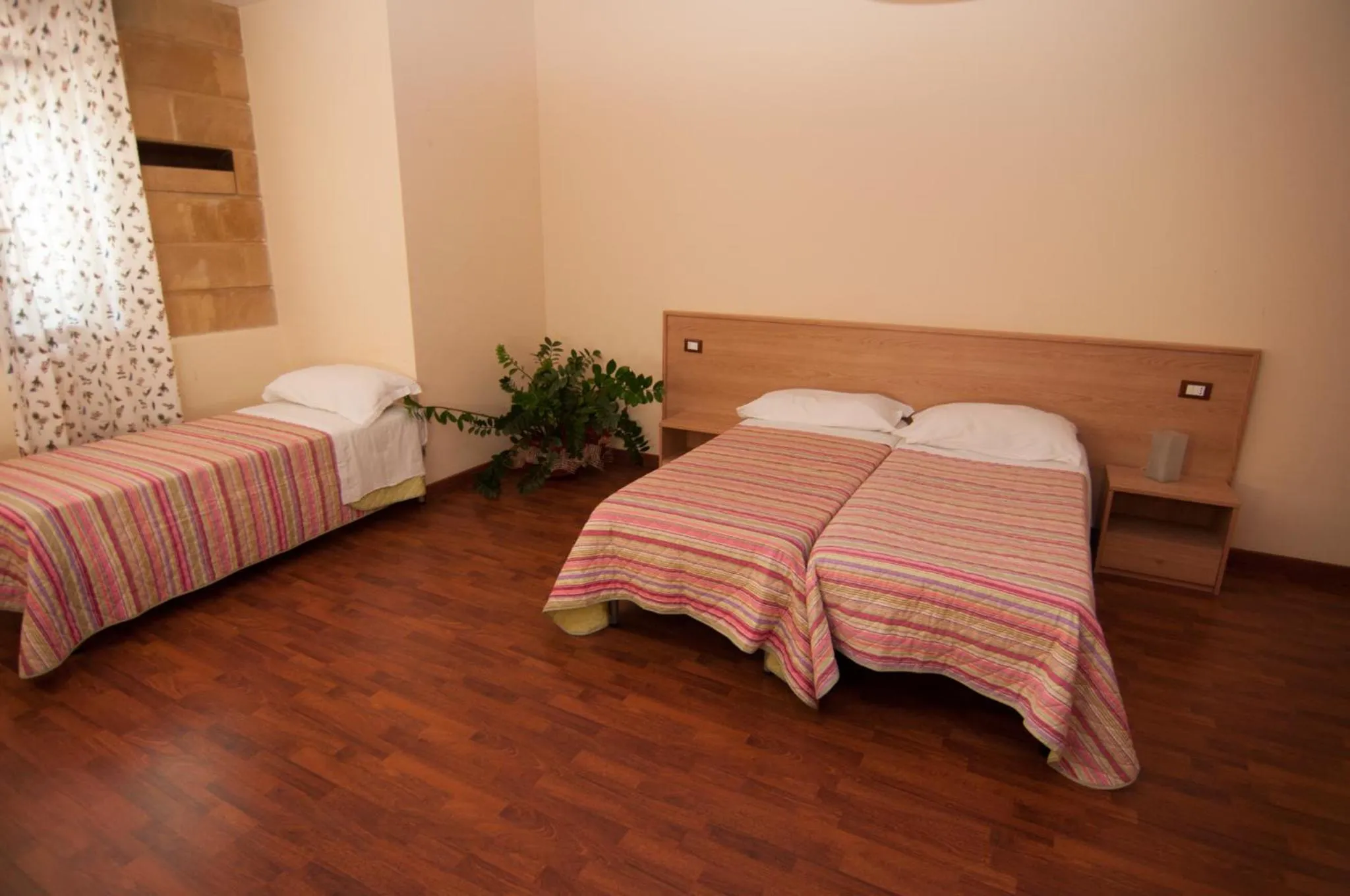 Bed in Albergo Conca D'Oro