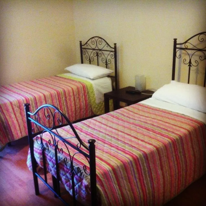 Bed in Albergo Conca D'Oro