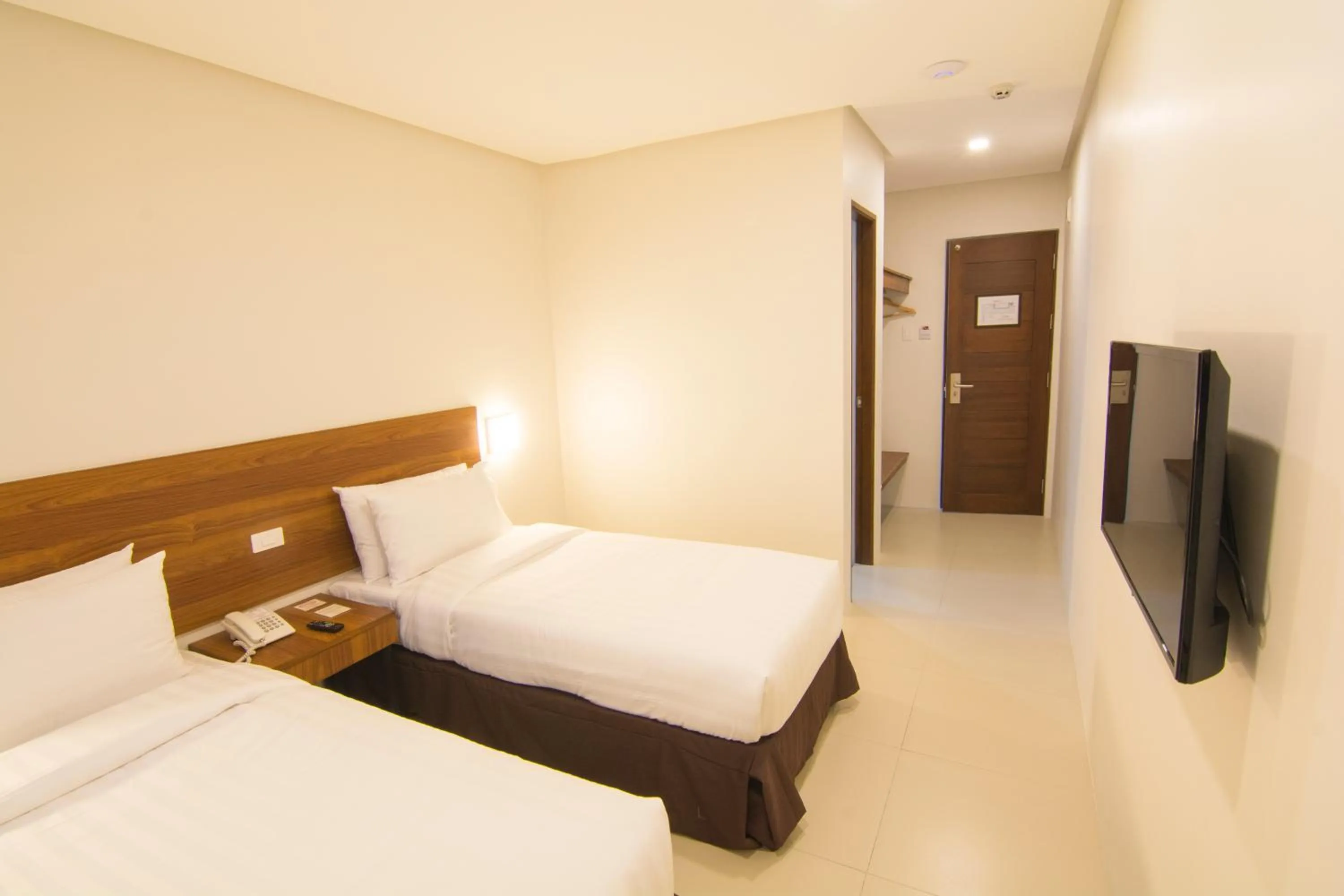 Bed in Mango Suites Cauayan