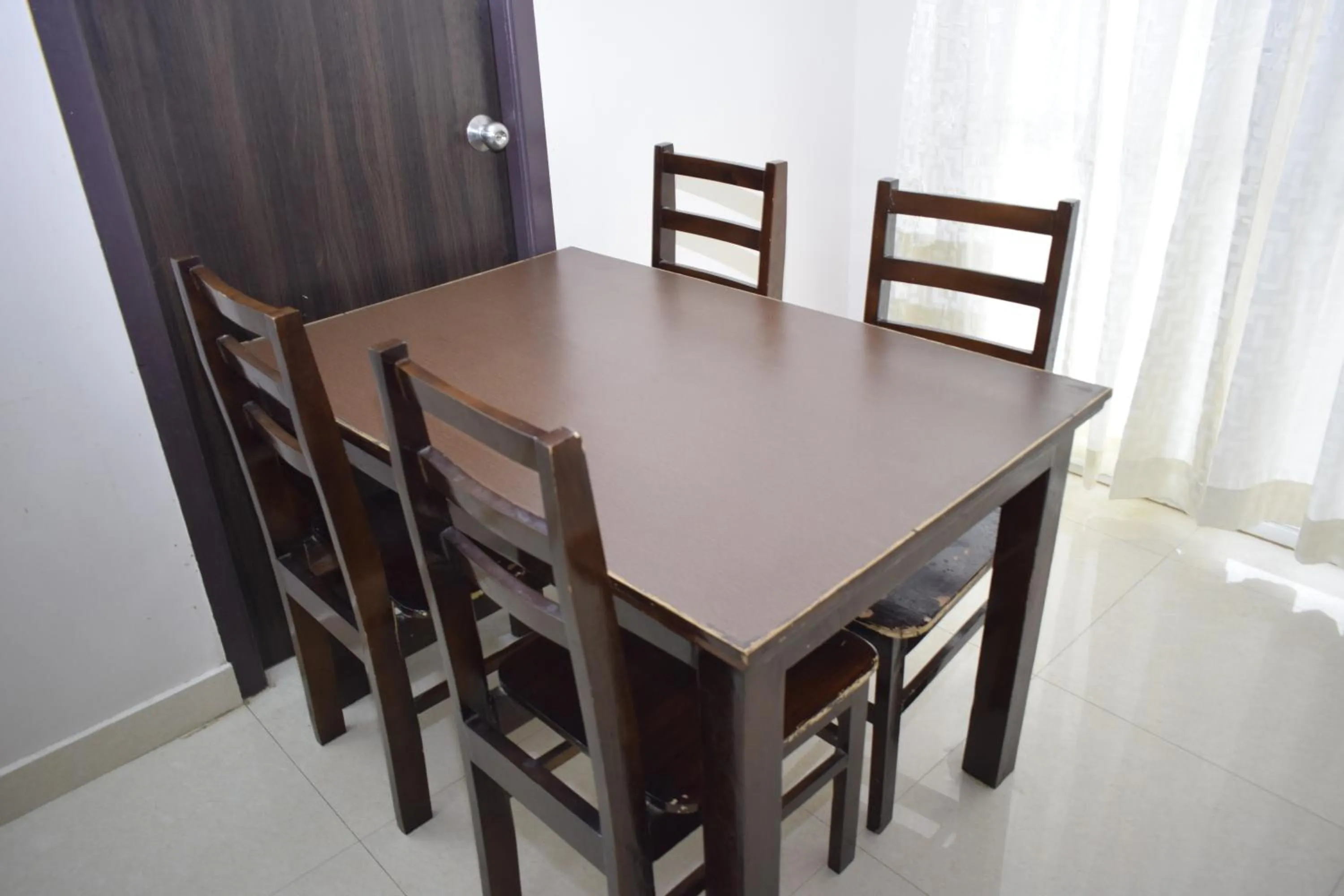 Dining area in Viswa Residency by Azalea