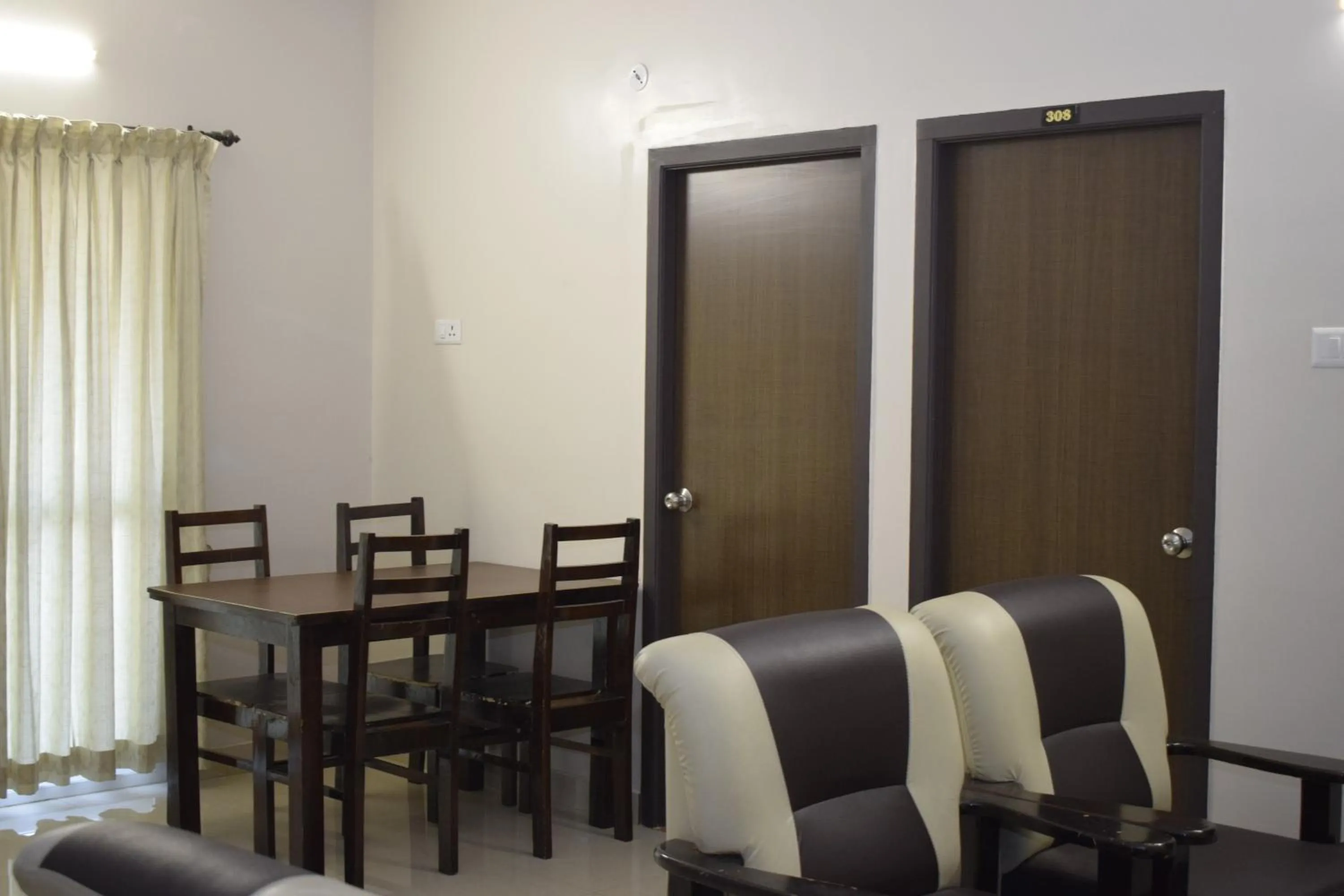 Dining area in Viswa Residency by Azalea