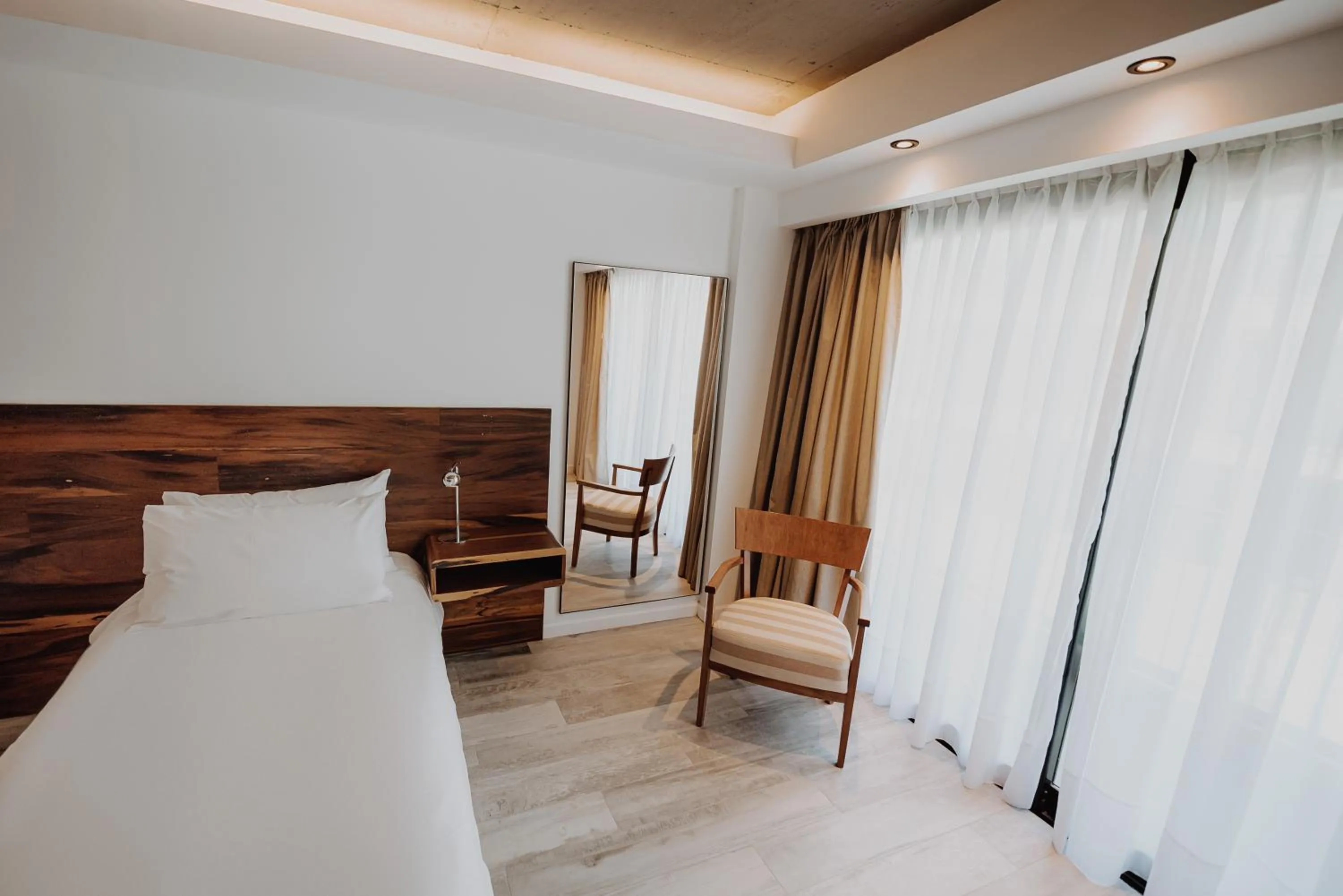 Bed in La Urumpta Hotel, AKEN MIND