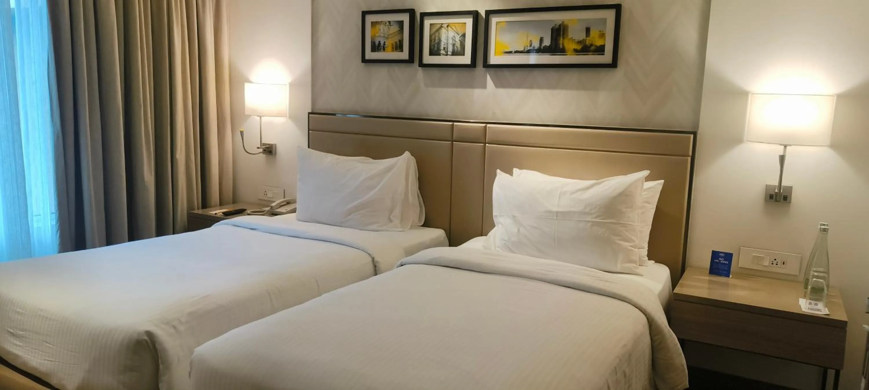 Bed in Royal Hometel Suites