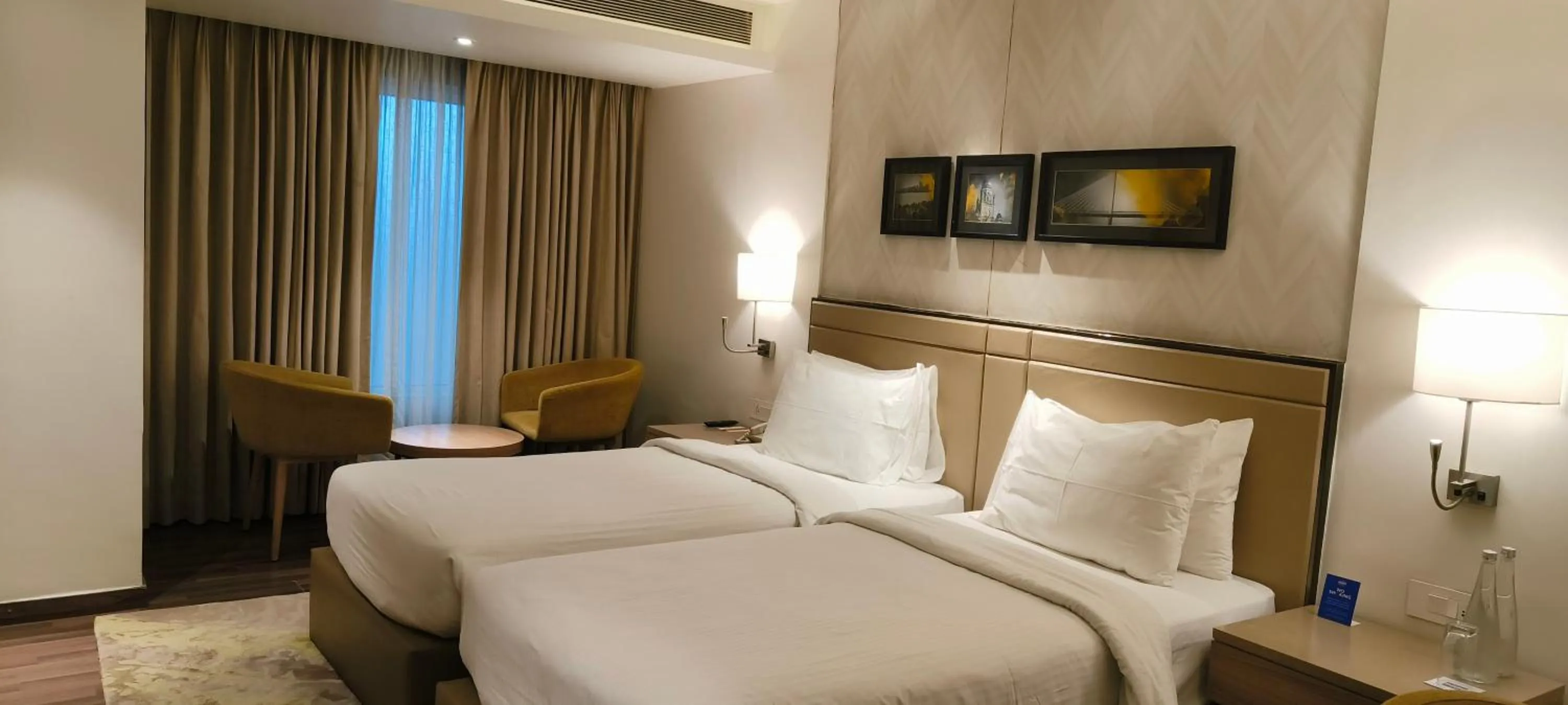 Bed in Royal Hometel Suites