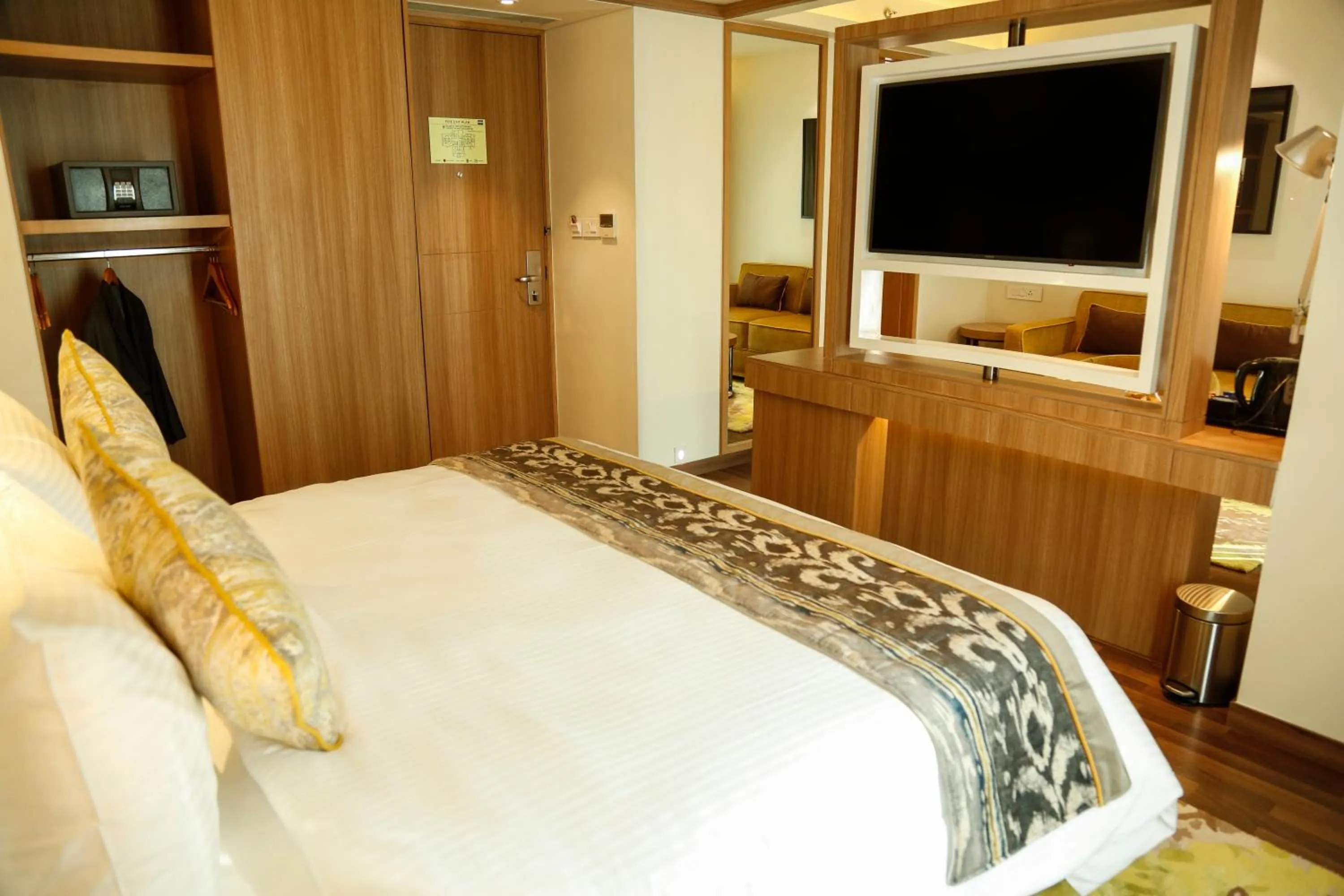 Bed in Royal Hometel Suites