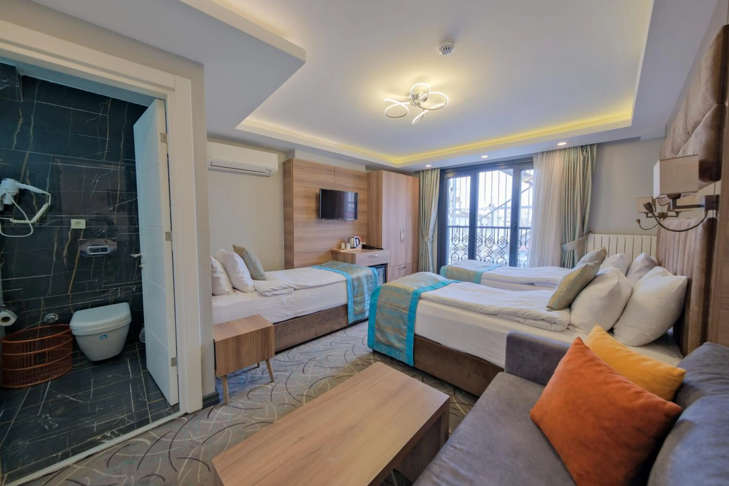 Bed in Grand Kavi Hotel