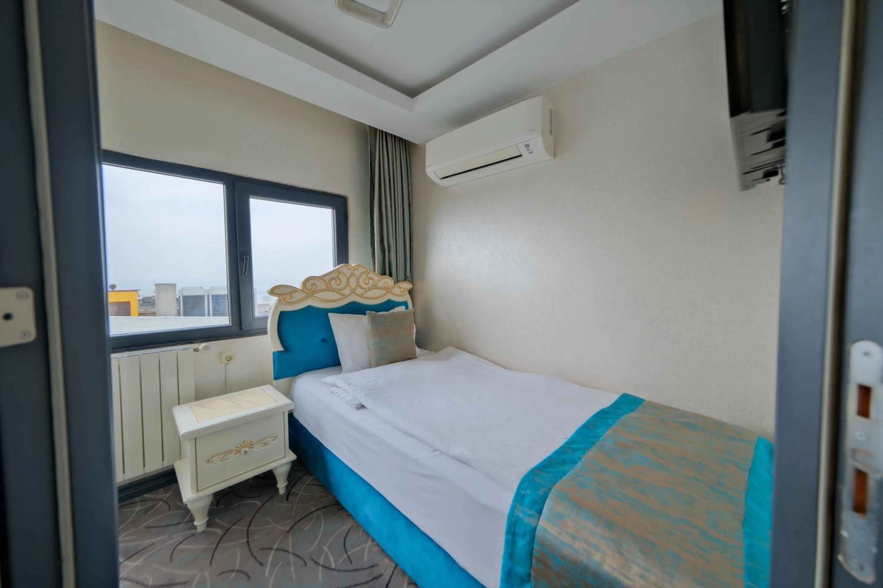 Bed in Grand Kavi Hotel