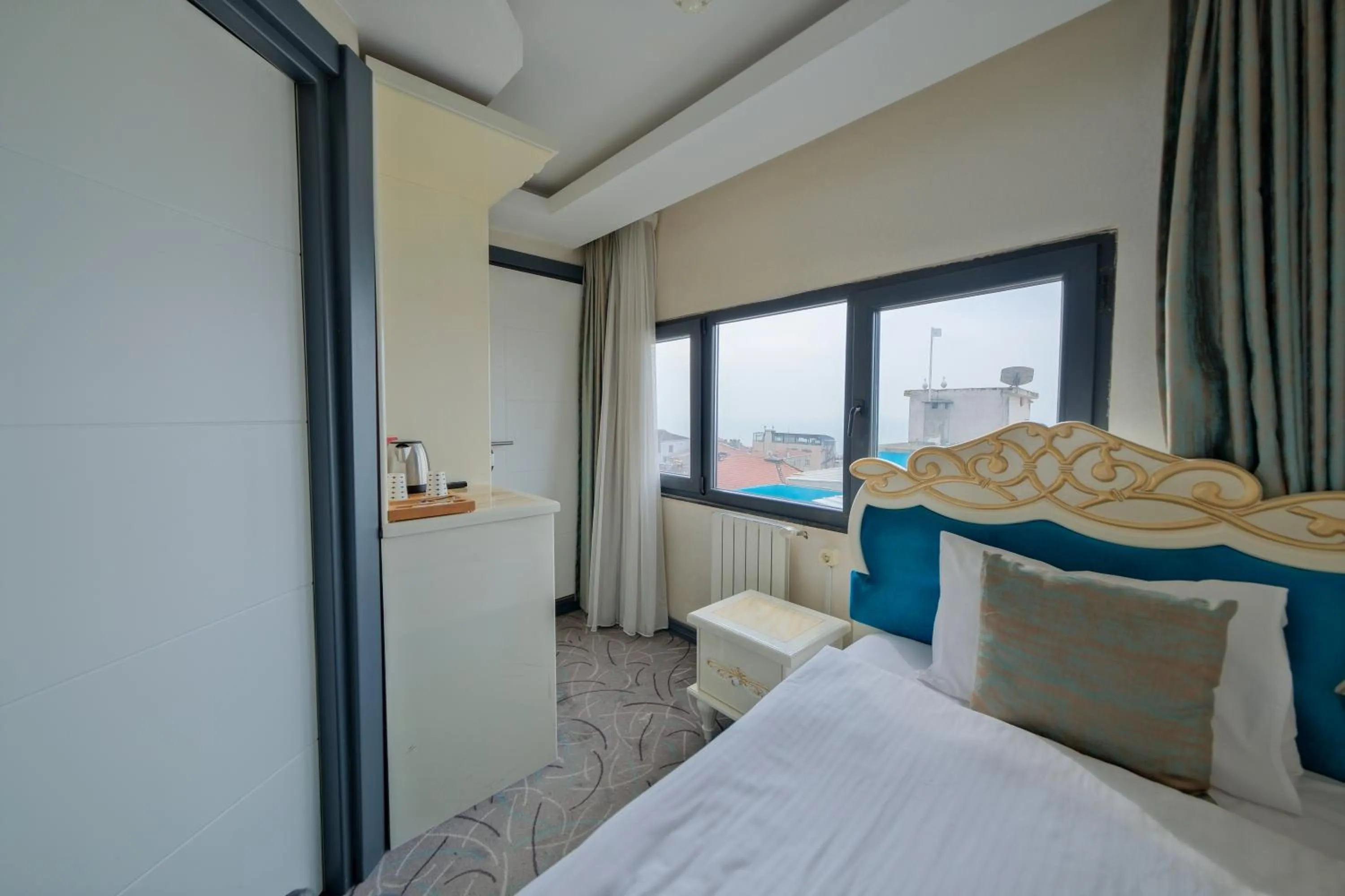 Bed in Grand Kavi Hotel