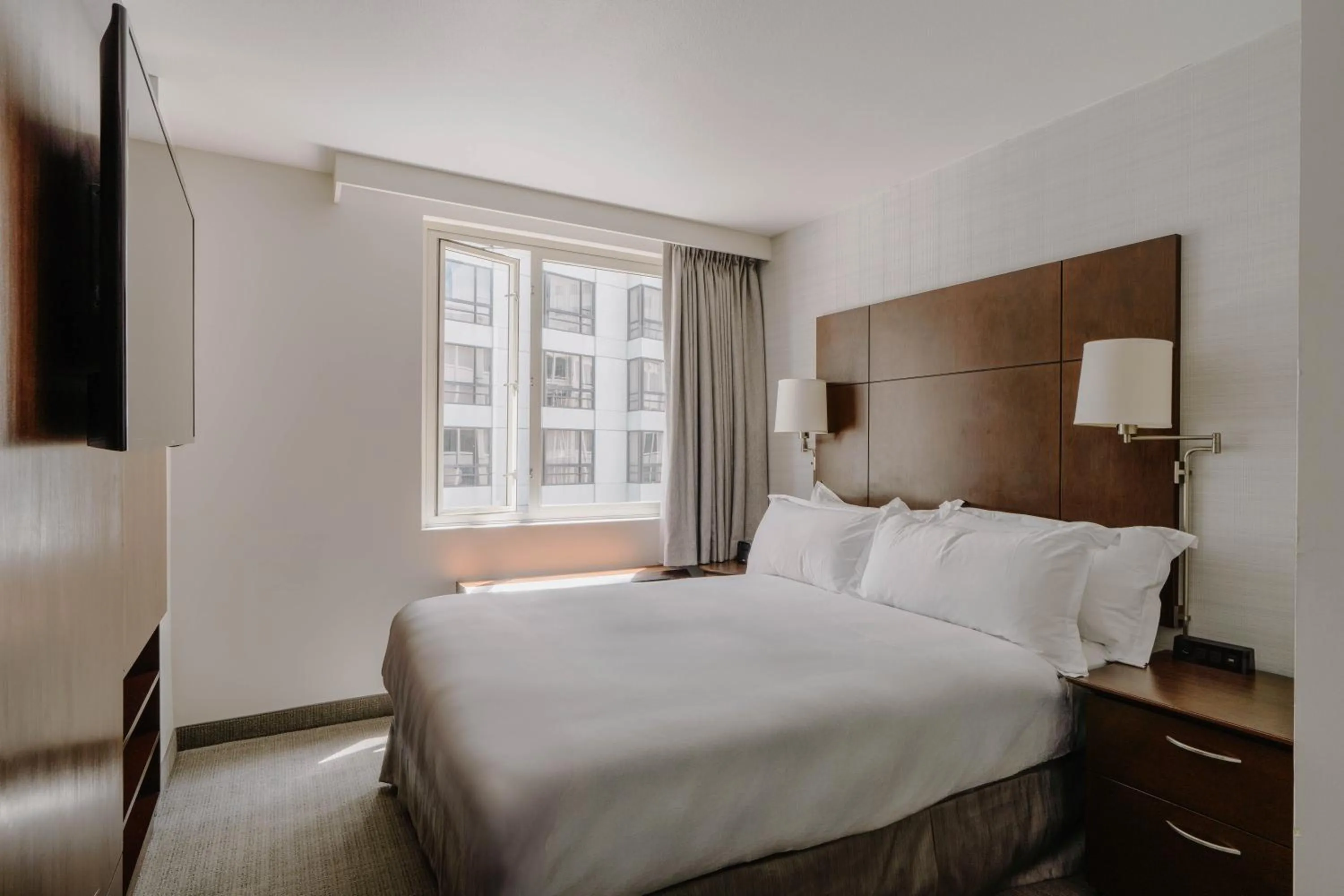 Bed in Club Quarters Hotel Embarcadero, San Francisco