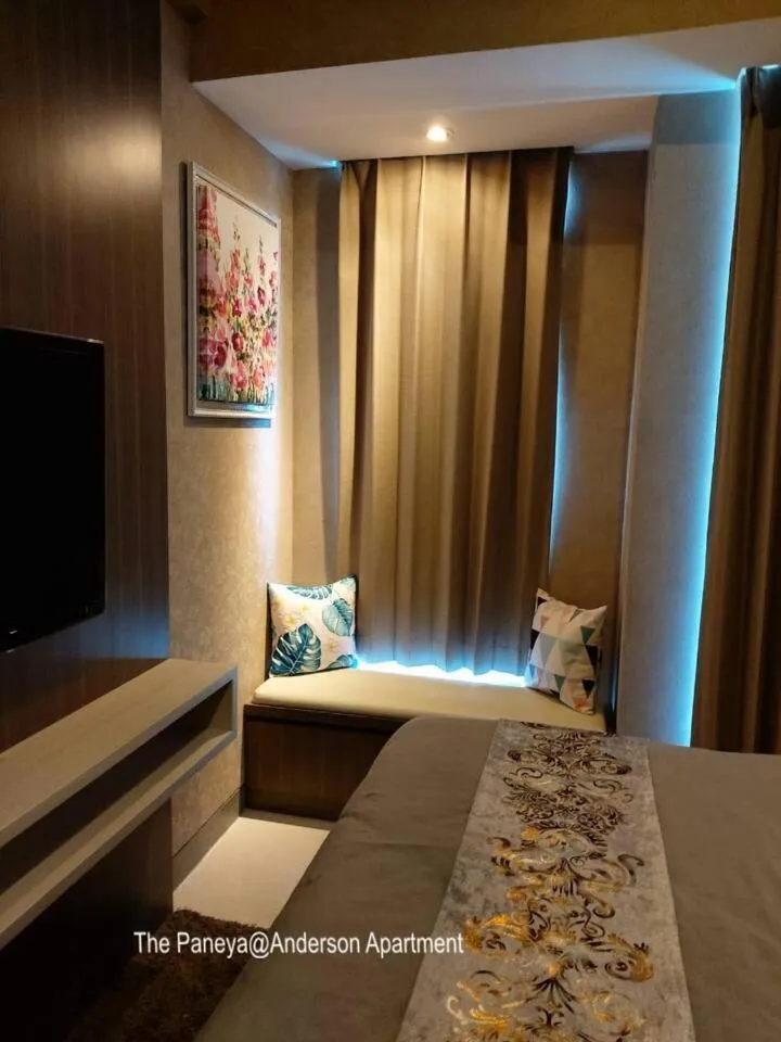 Seating area, Bed in The Paneya@Anderson Apartment