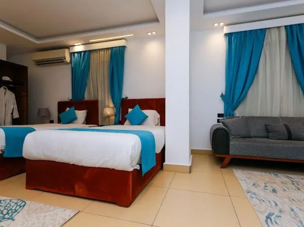 Living room, Bed in Pyramids Gem Plaza Boutique Hotel & Restaurant