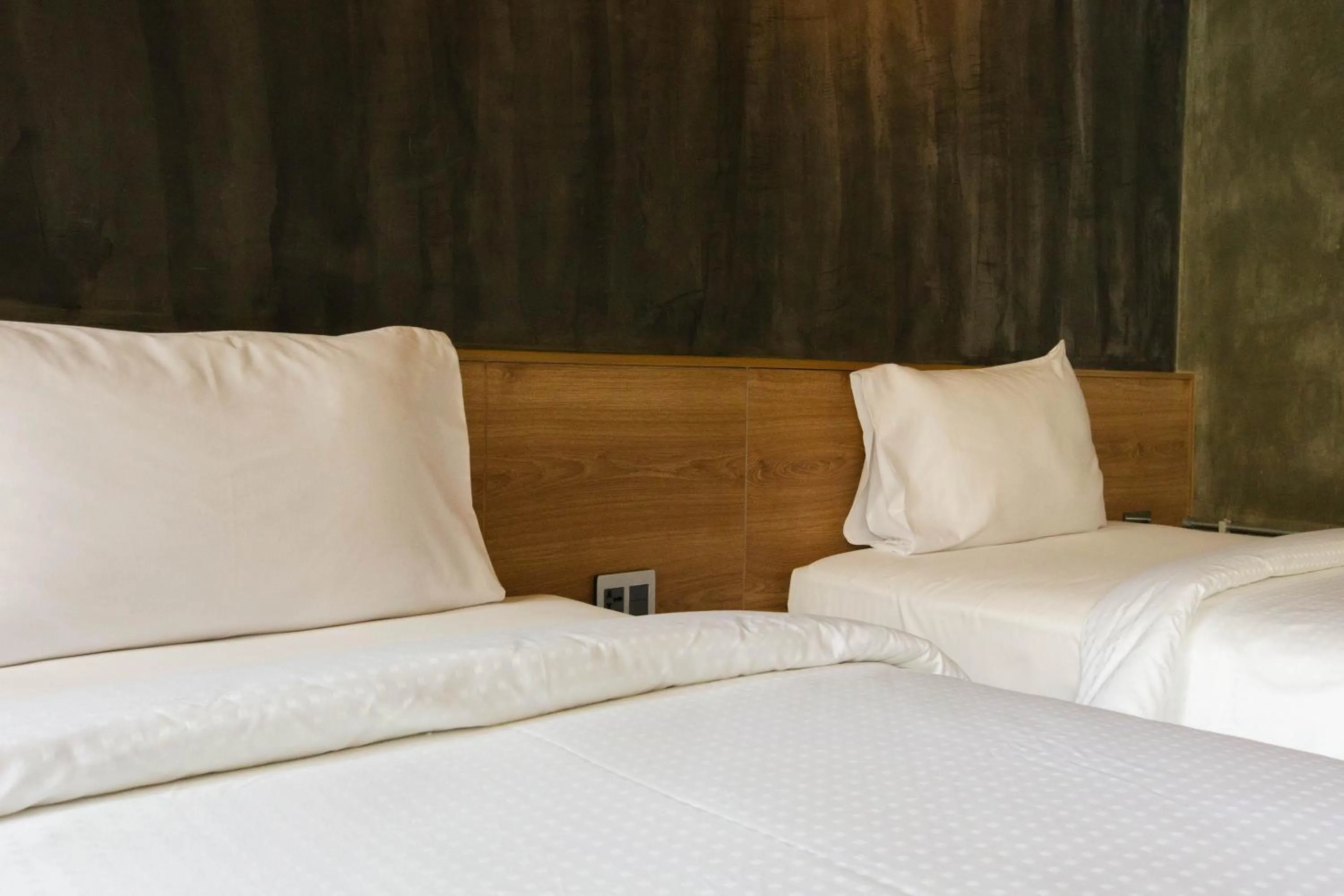 Bed in Navakitel Design Hotel