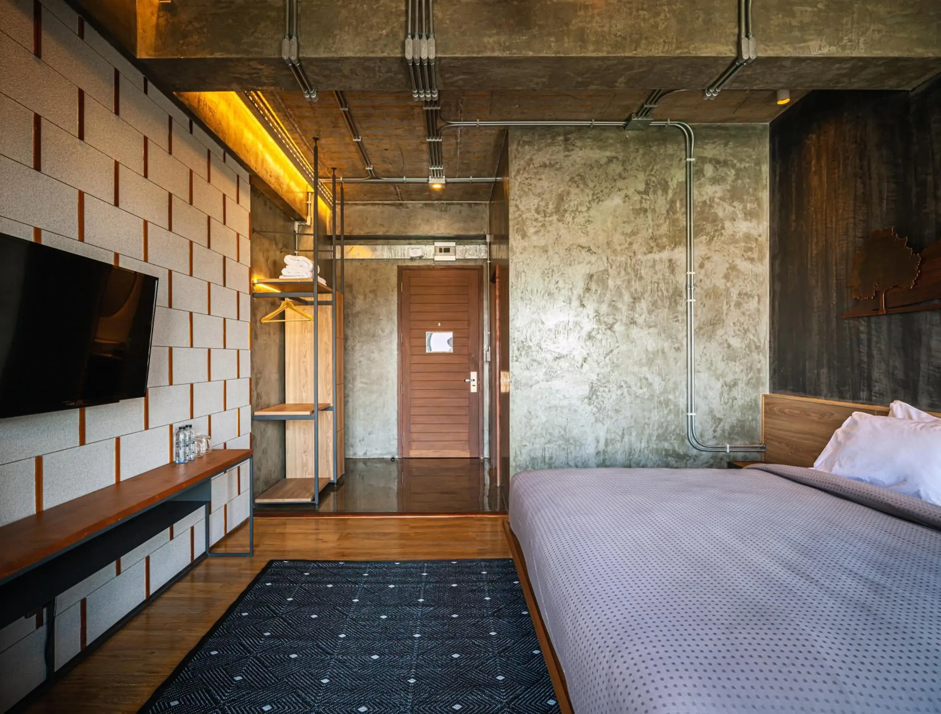 Communal lounge/ TV room, Bed in Navakitel Design Hotel Communal lounge/ TV room, Bed in Navakitel Design Hotel