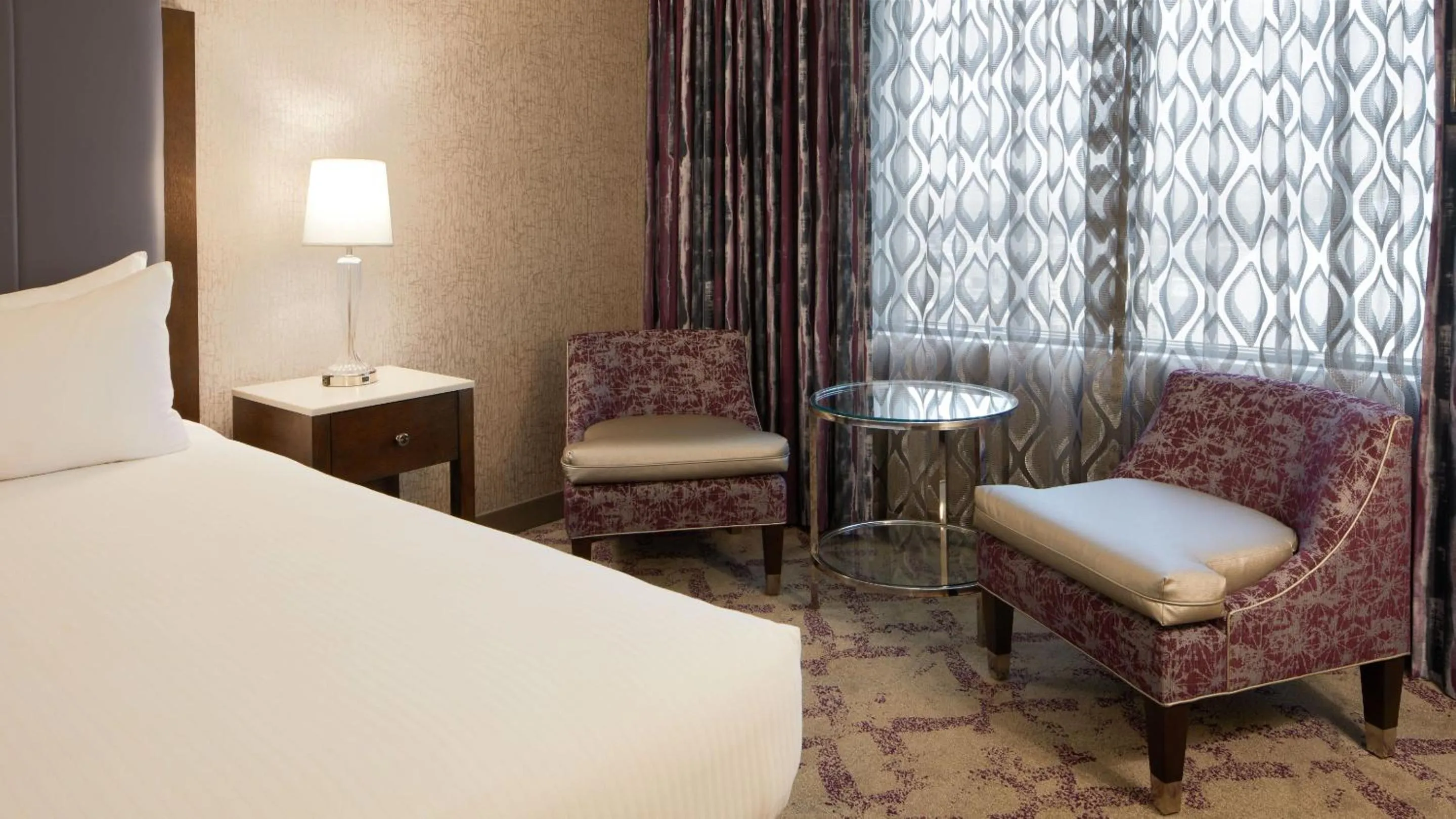 Seating area, Bed in Silver Legacy Reno, A Caesars Destination