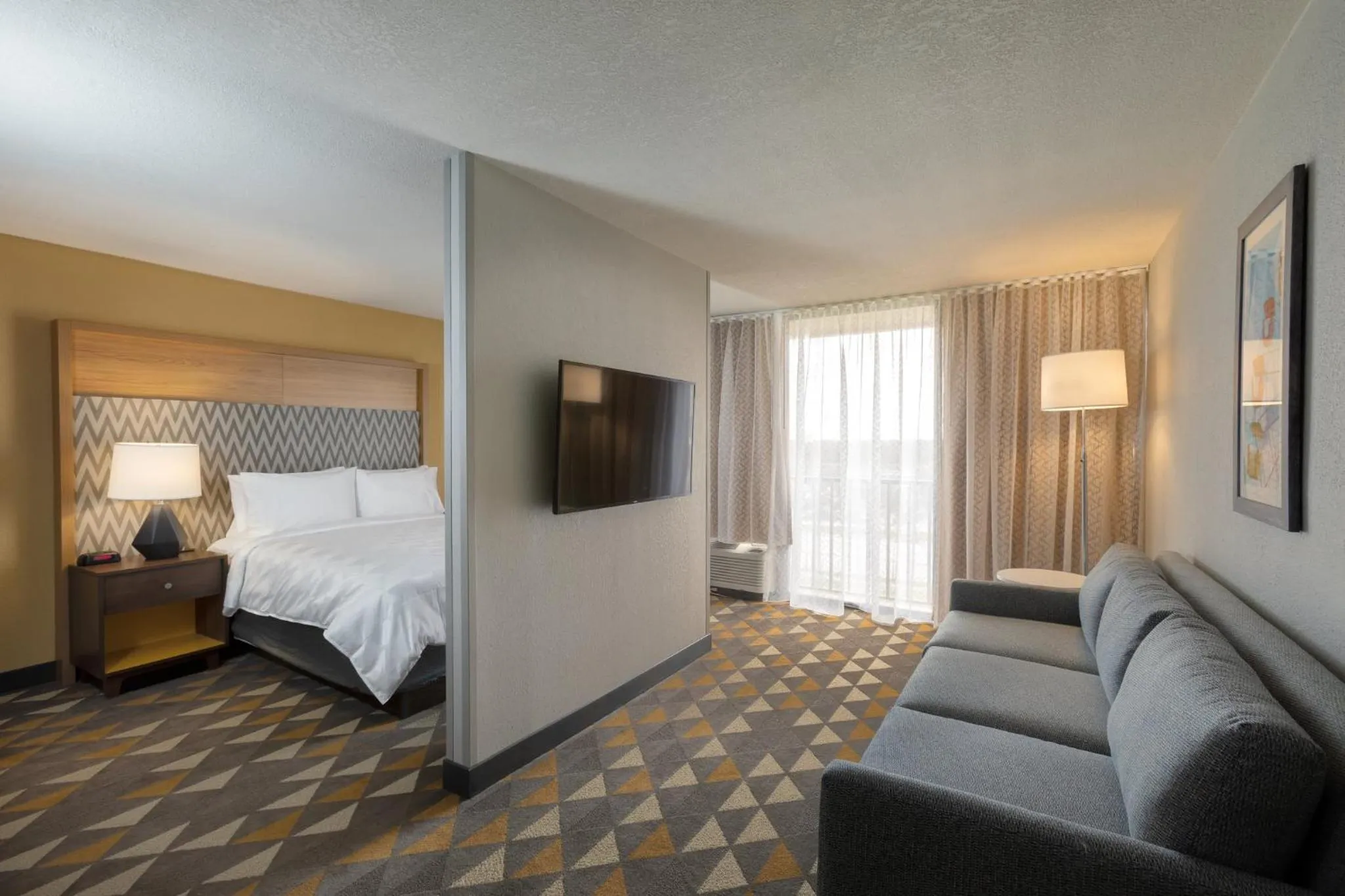 Photo of the whole room, Bed in Holiday Inn & Suites Orlando SW - Celebration Area by IHG
