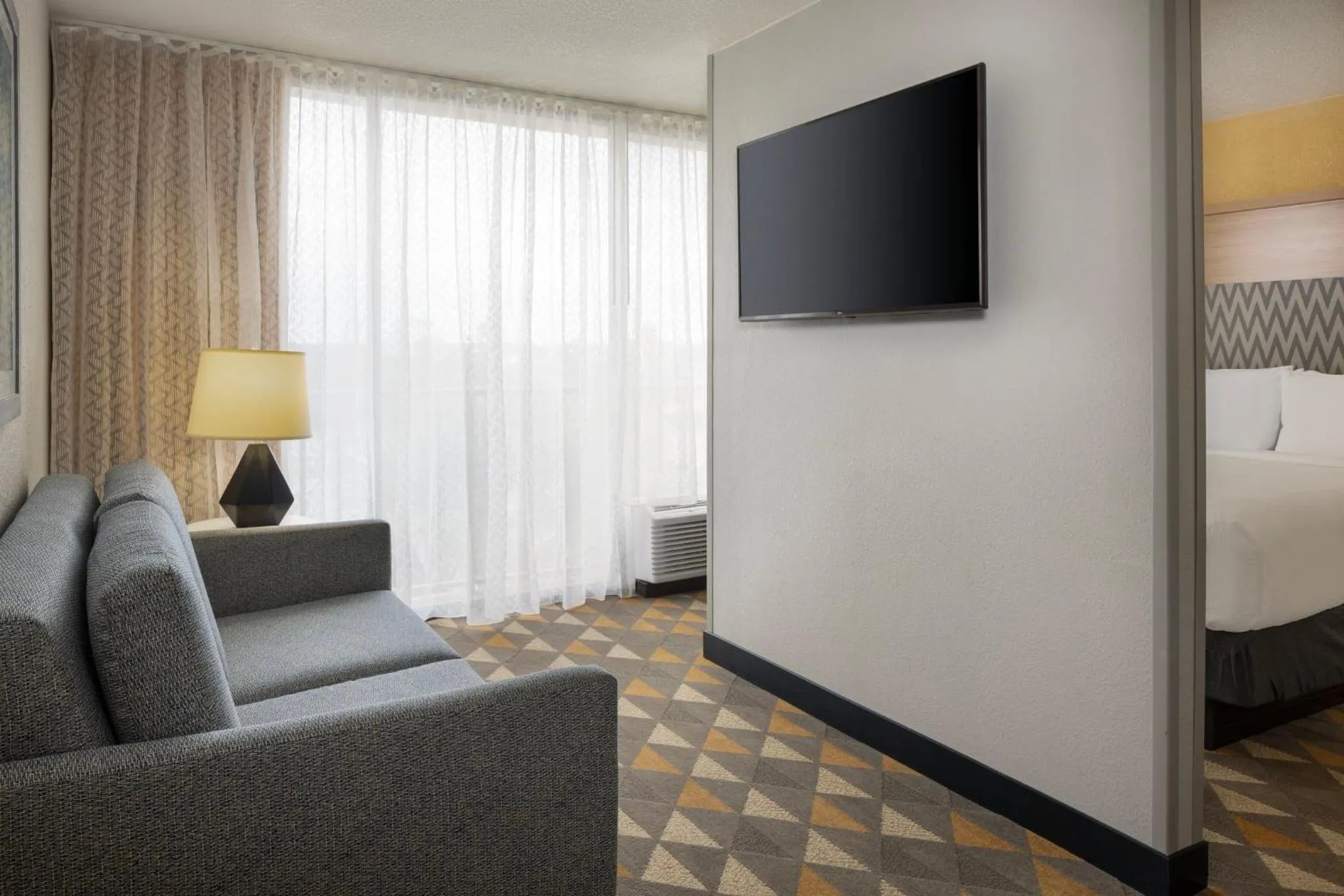 Photo of the whole room, Bed in Holiday Inn & Suites Orlando SW - Celebration Area by IHG