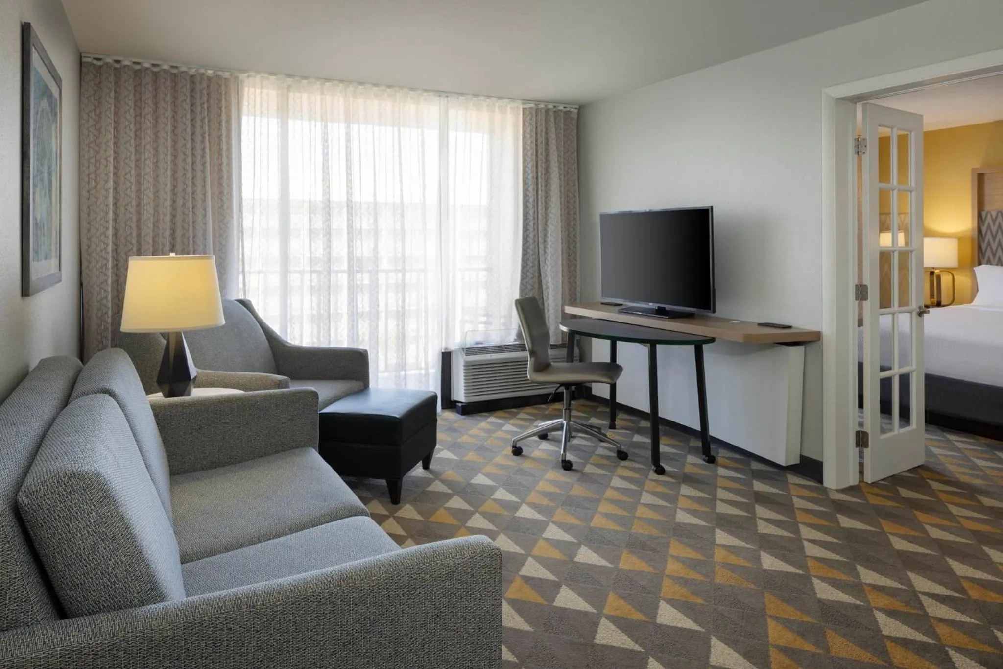 Photo of the whole room, Bed in Holiday Inn & Suites Orlando SW - Celebration Area by IHG
