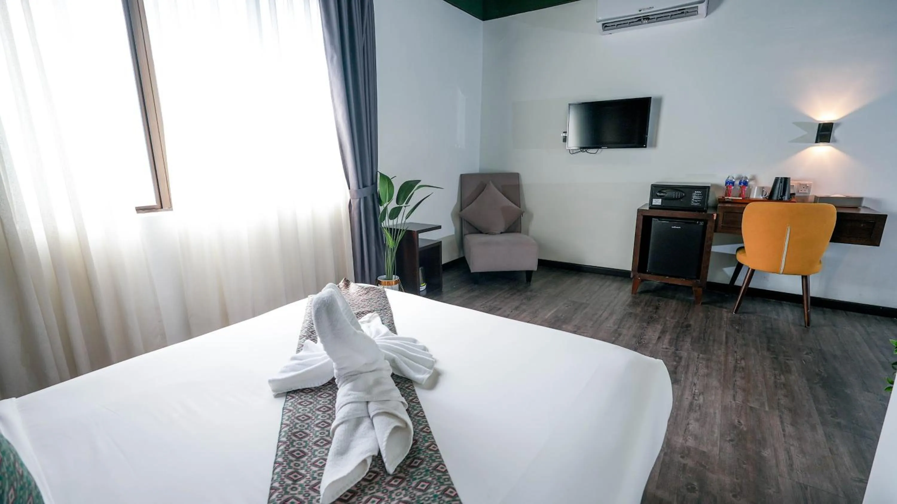 Seating area, Bed in East Riverine Boutique Hotel