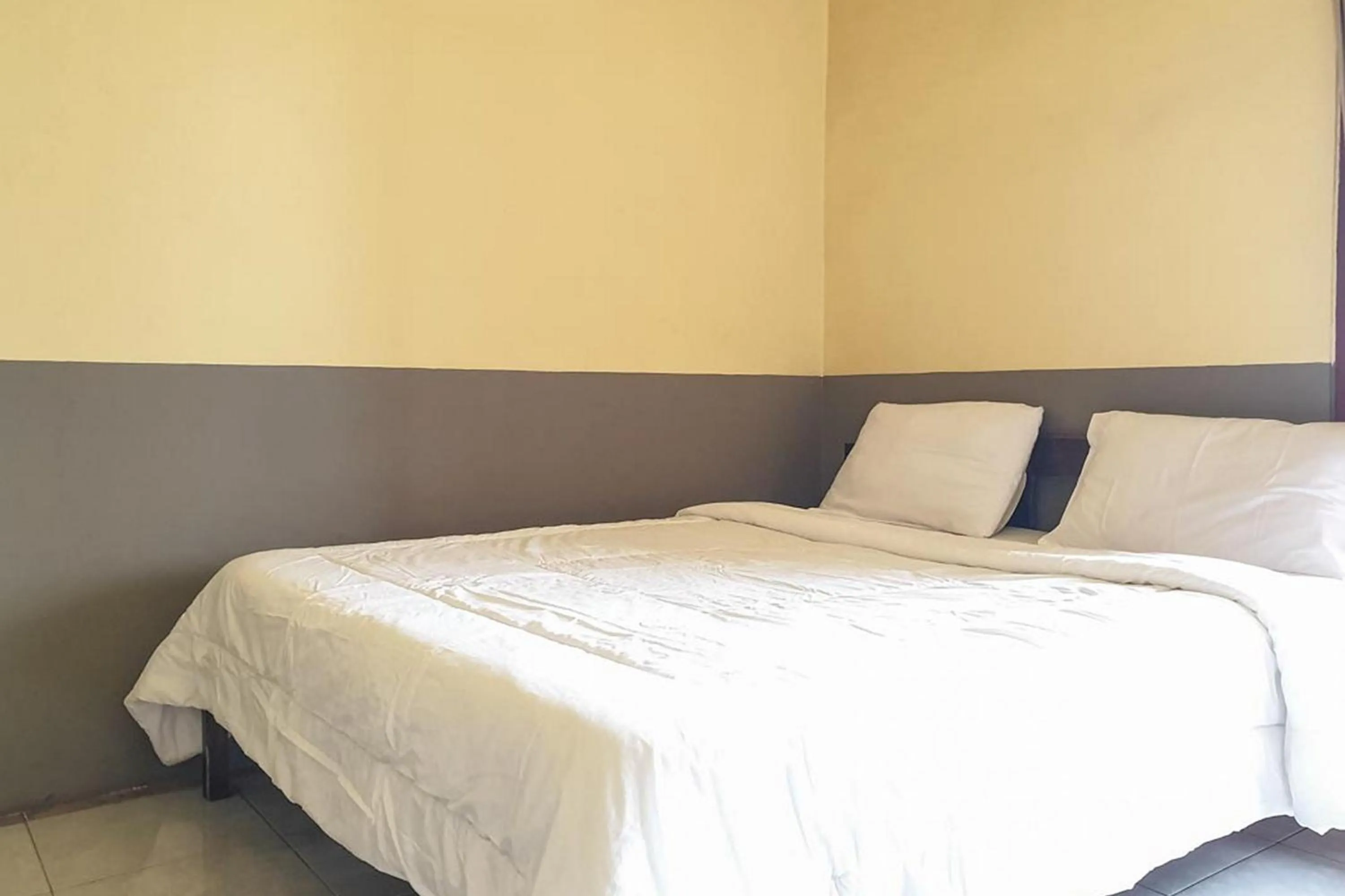 Bed in Tengger Indah Bromo Homestay at Desa Wisata Bromo Mitra RedDoorz