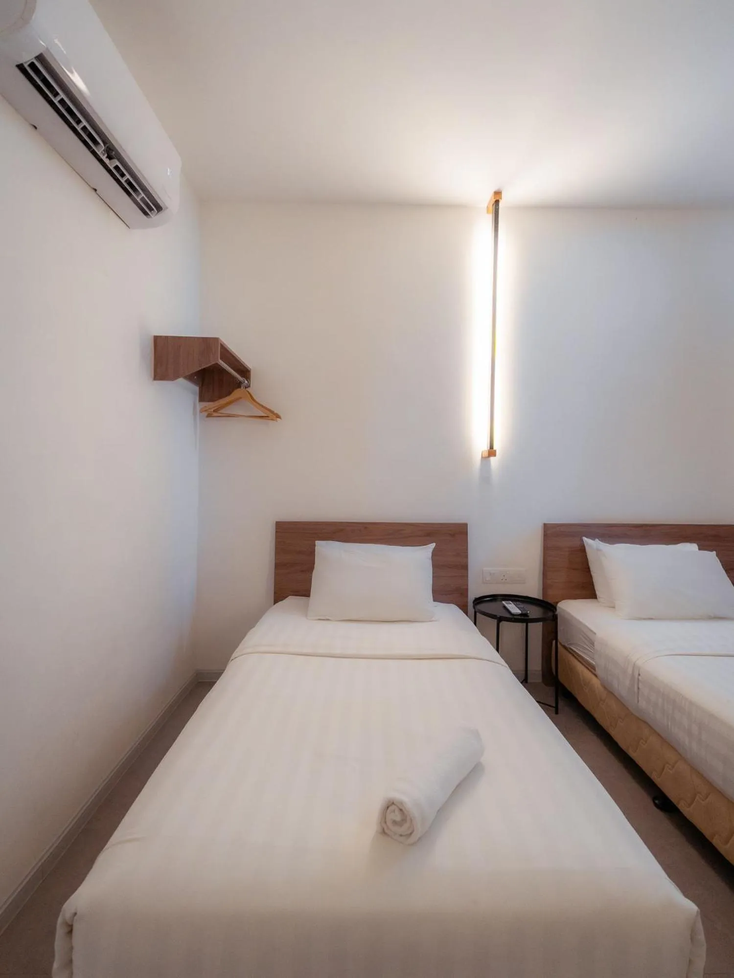 Bed in T+ PREMIUM HOTEL