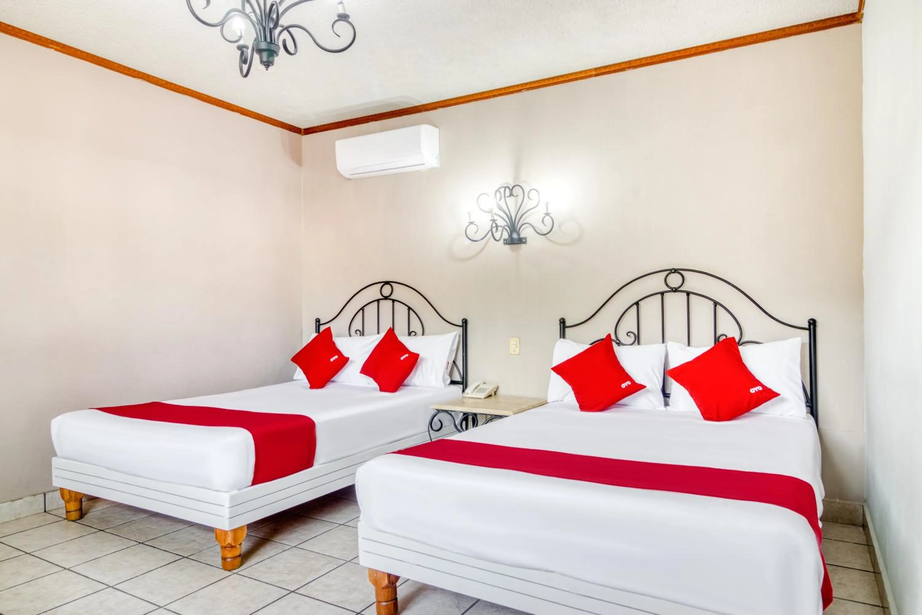 Bedroom in Capital O Hotel La Siesta, Gomez Palacio