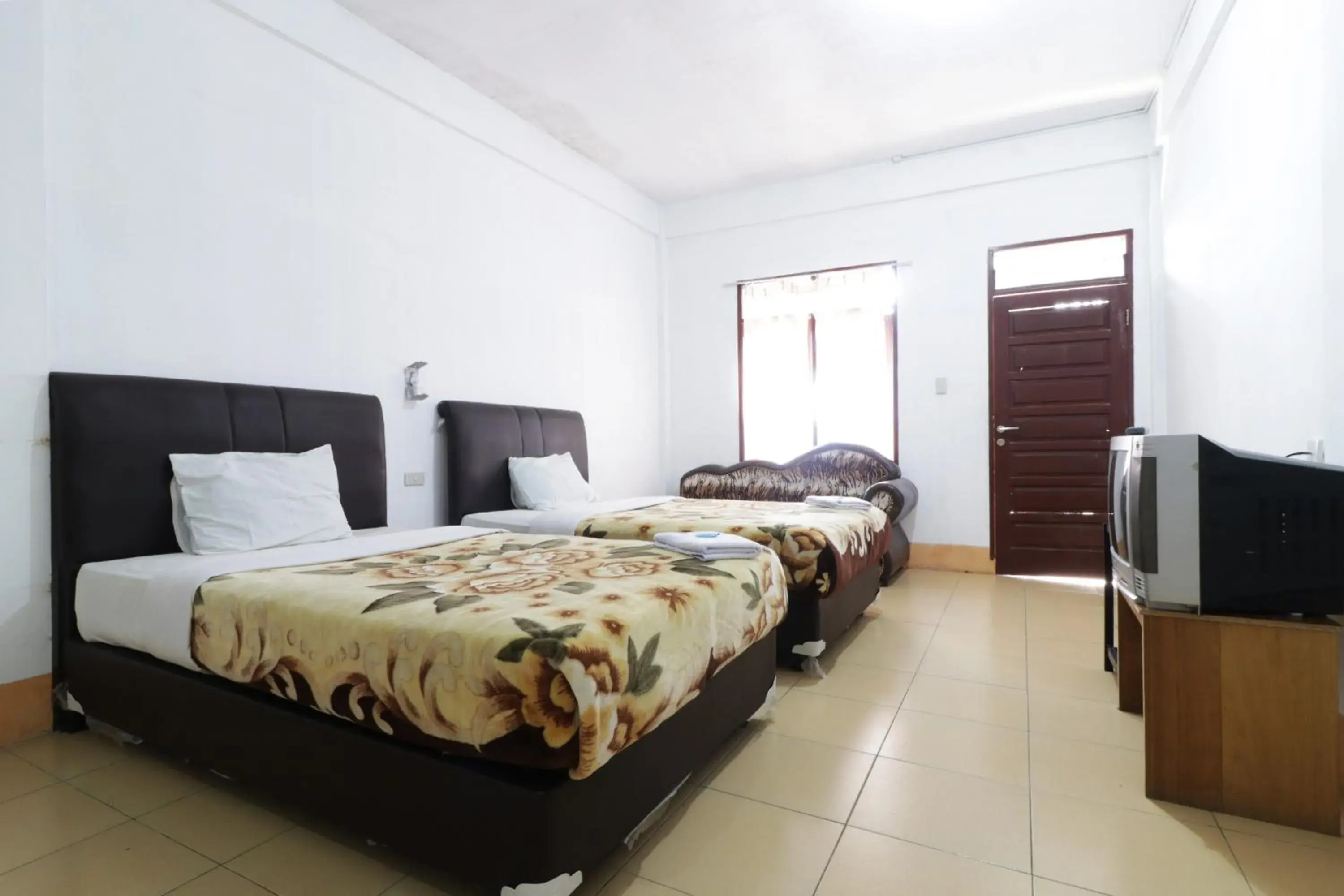 Bed in Villa Keluarga Bre Batunanggar Bed in Villa Keluarga Bre Batunanggar