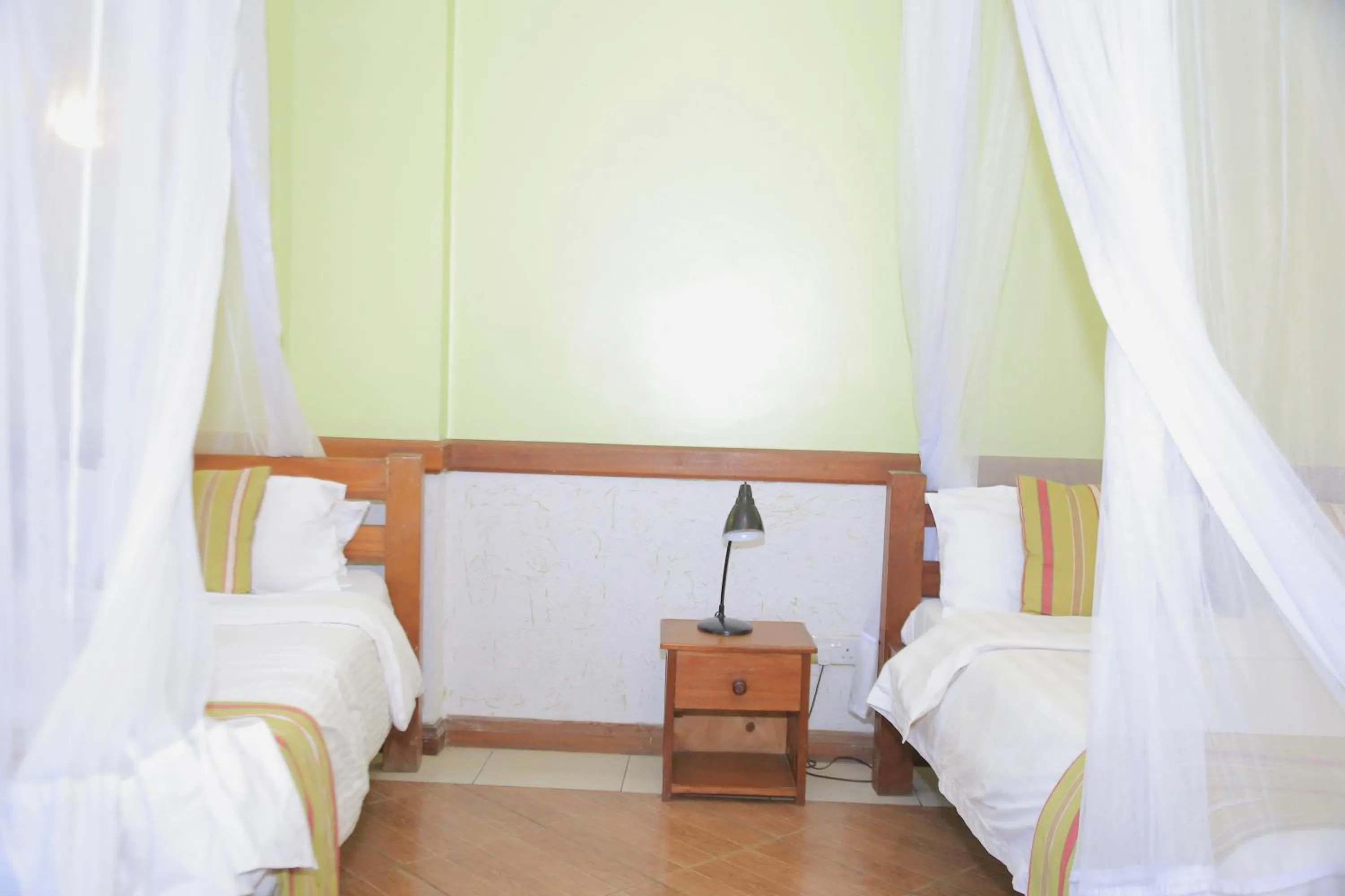 Bed in ACK Guest House Nairobi