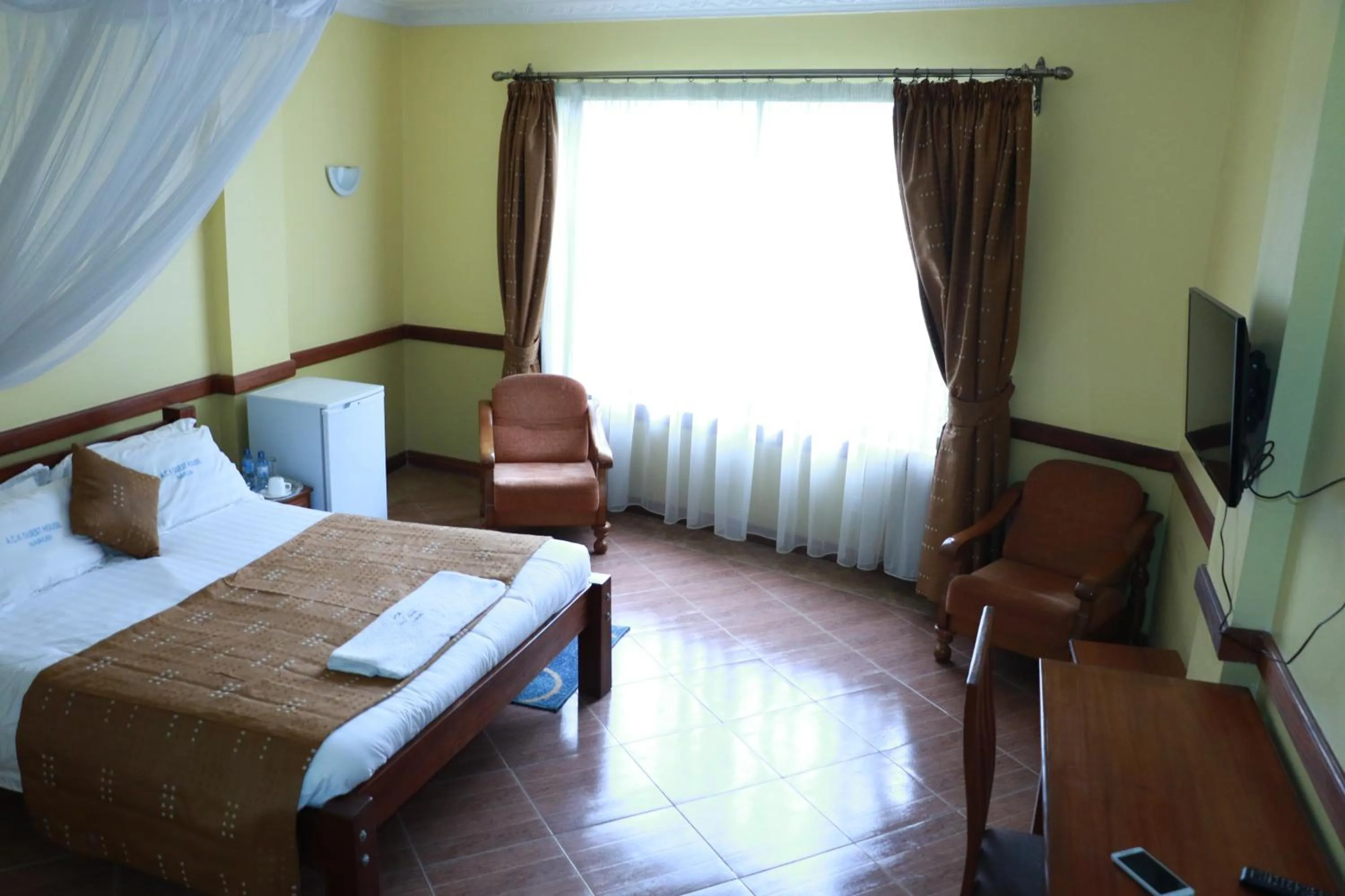 Bed in ACK Guest House Nairobi