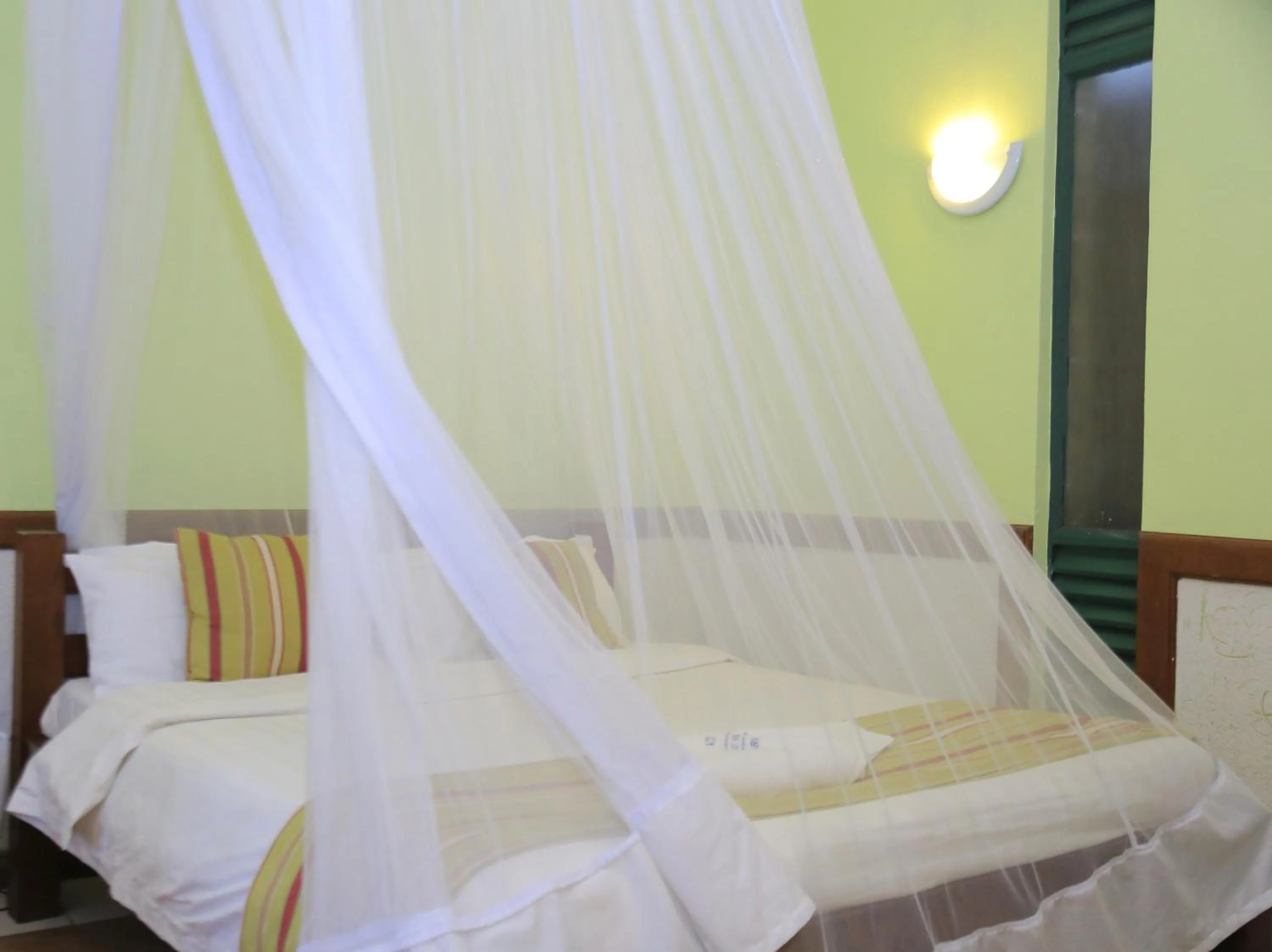 Bed in ACK Guest House Nairobi